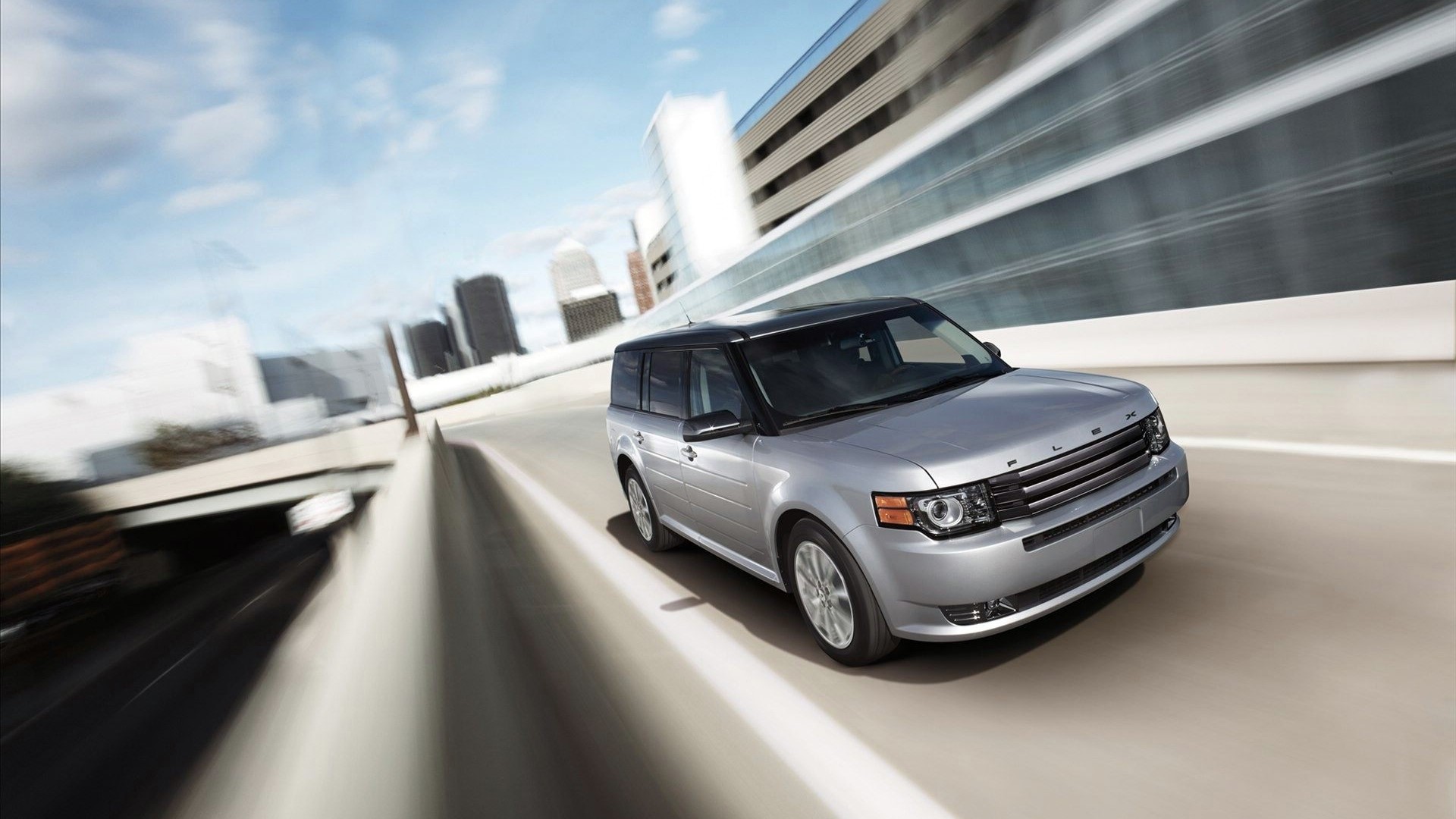 Silver Ford Flex driving on a highway HD Wallpaper