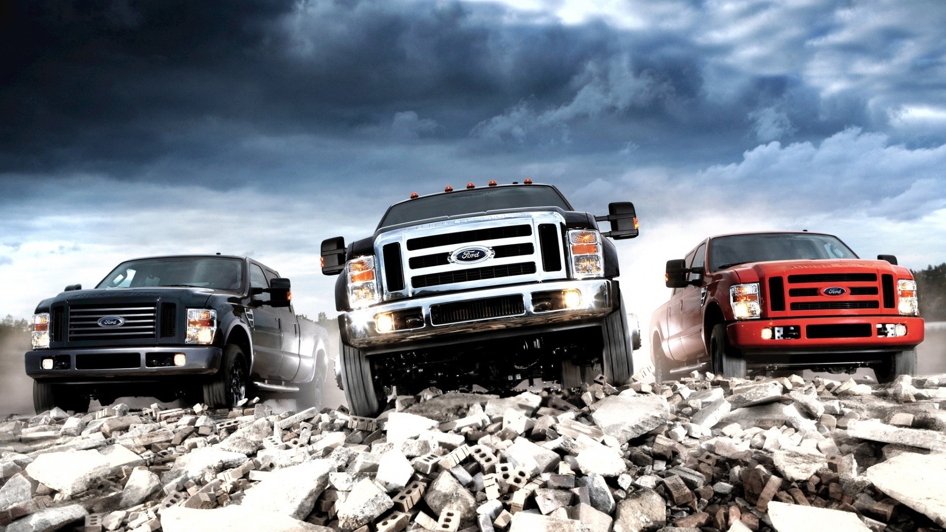 Three Ford Trucks on a Rubble Field HD Wallpaper