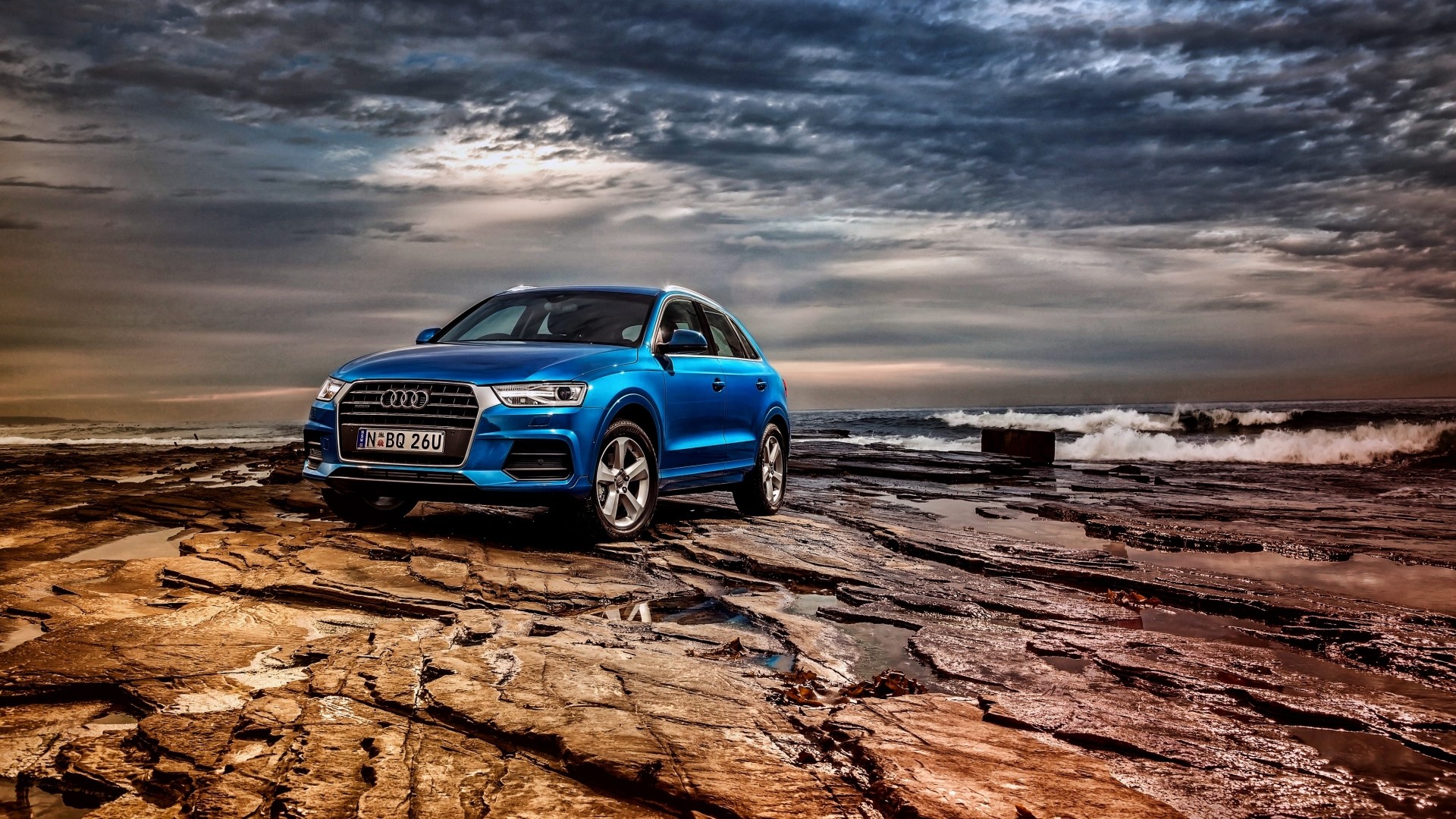 Blue Audi Q3 on Rocky Beach HD Wallpaper
