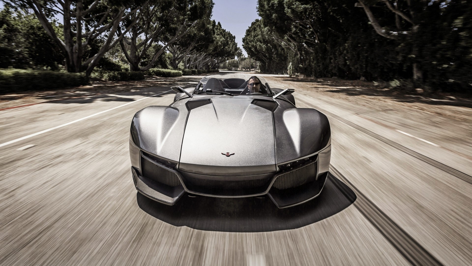 Rezvani Beast car driving on a tree-lined road HD Wallpaper