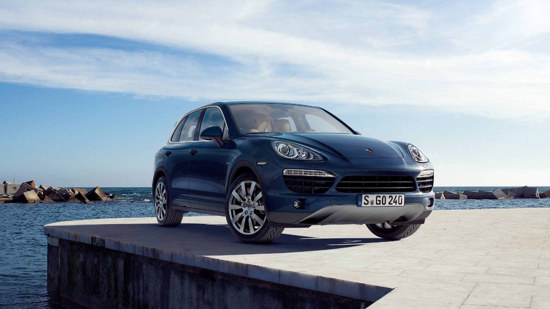 Porsche Cayenne parked on a pier by the sea HD Wallpaper