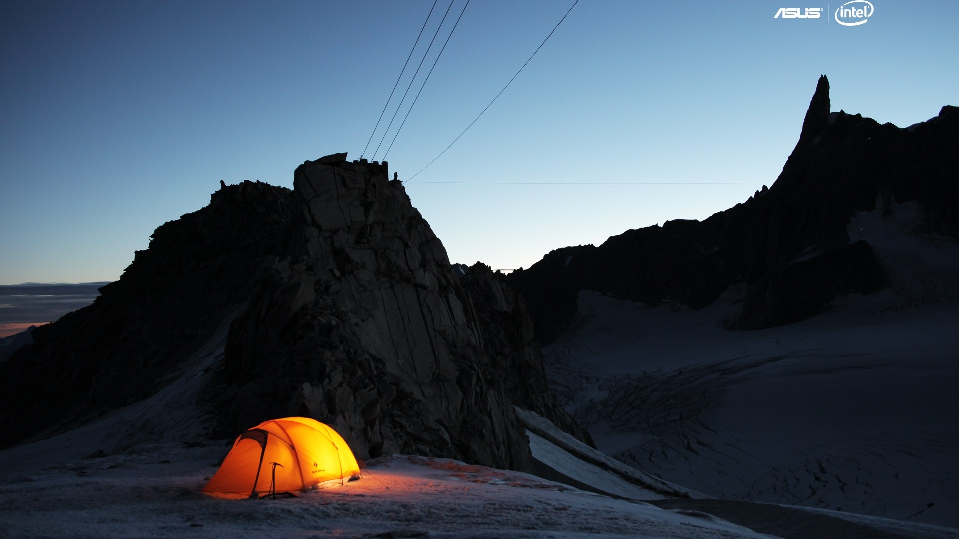 Tent at dusk on a mountain with Asus and Intel logos HD Wallpaper