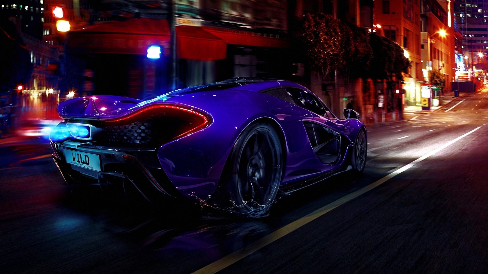 Purple McLaren P1 driving on a city street at night HD Wallpaper