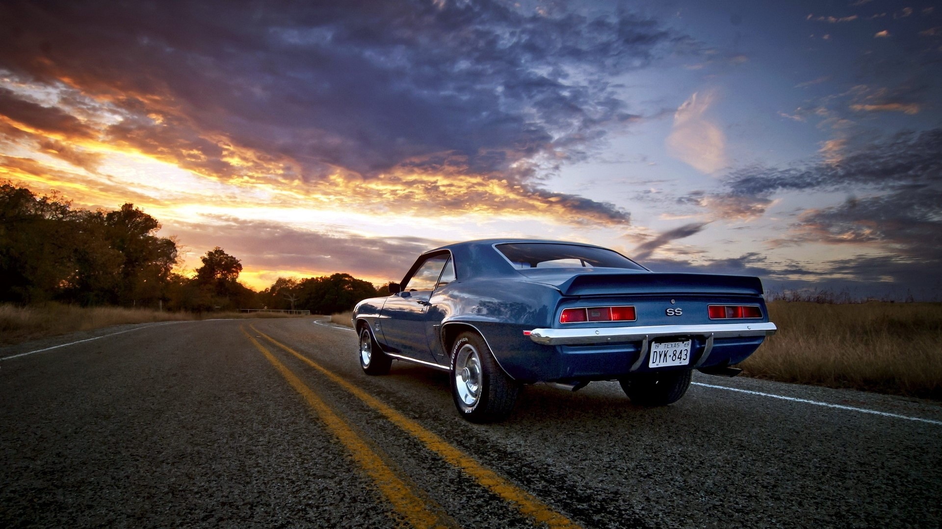 1969 Chevrolet Camaro SS on a road at sunset HD Wallpaper