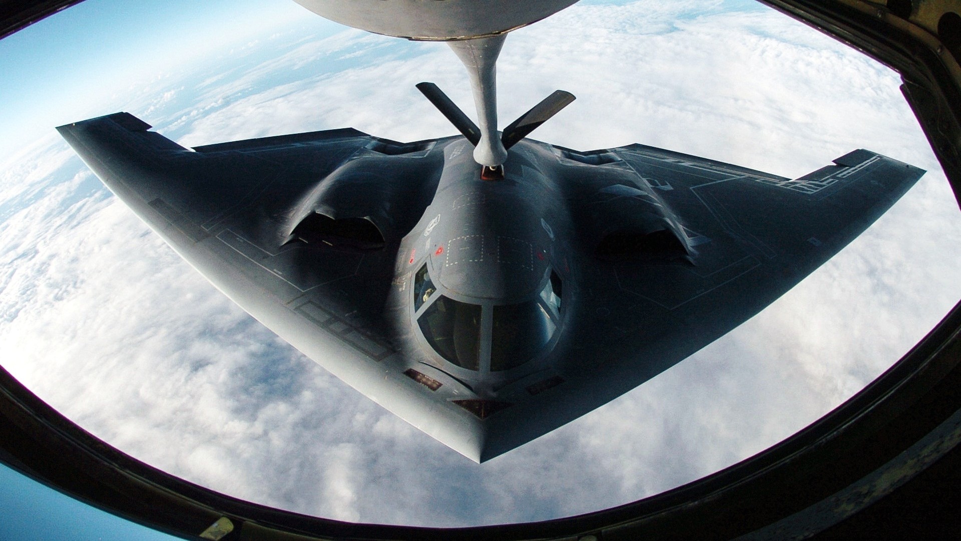 B-2 Spirit bomber refueling in the sky HD Wallpaper