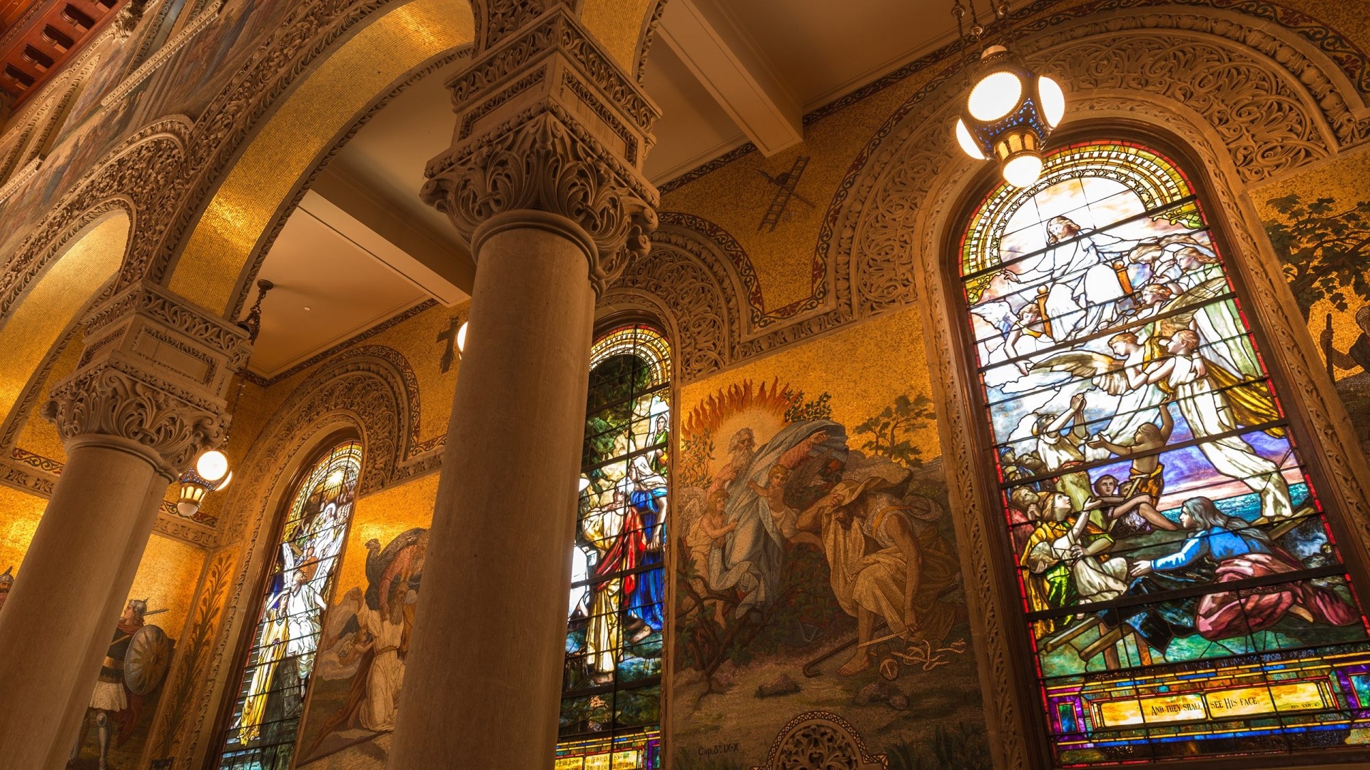 Interior of a cathedral with stained glass windows and mosaics HD Wallpaper