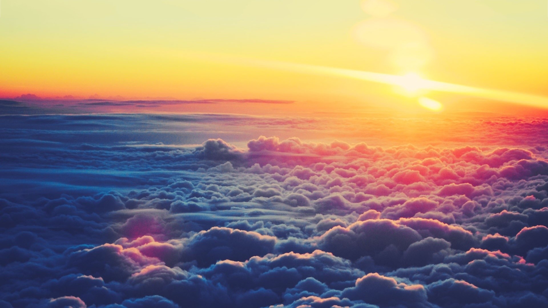 Sunset over a sea of clouds HD Wallpaper
