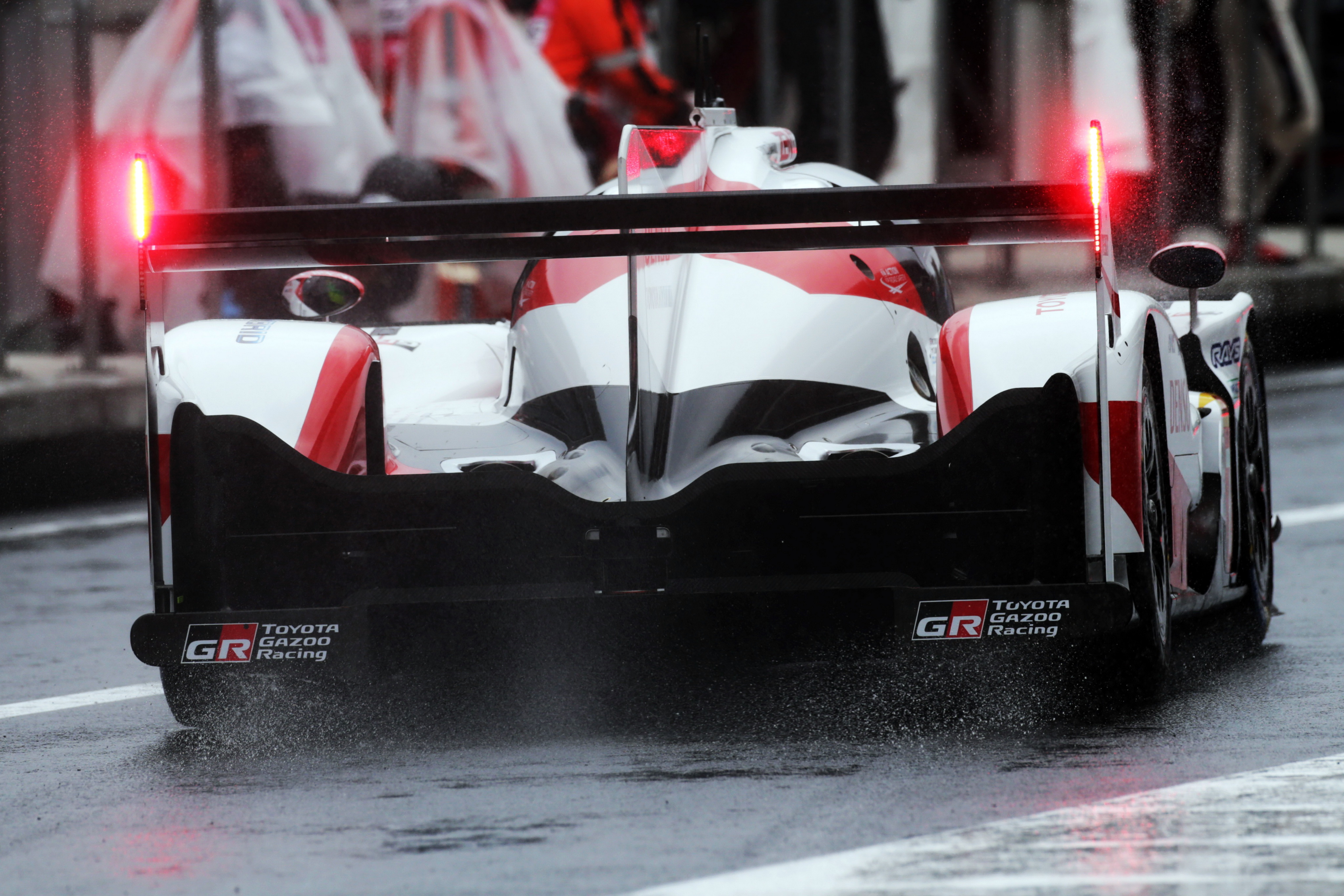 Toyota TS050 Hybrid racing car in the rain HD Wallpaper