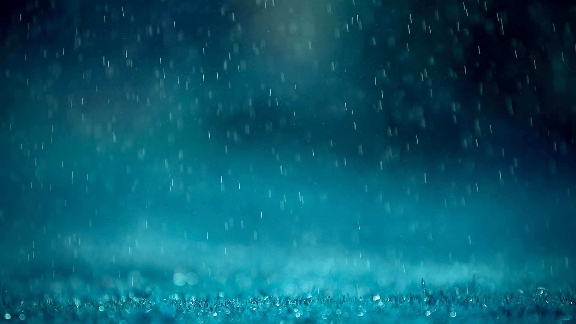 Rain falling on grass with blue lighting HD Wallpaper