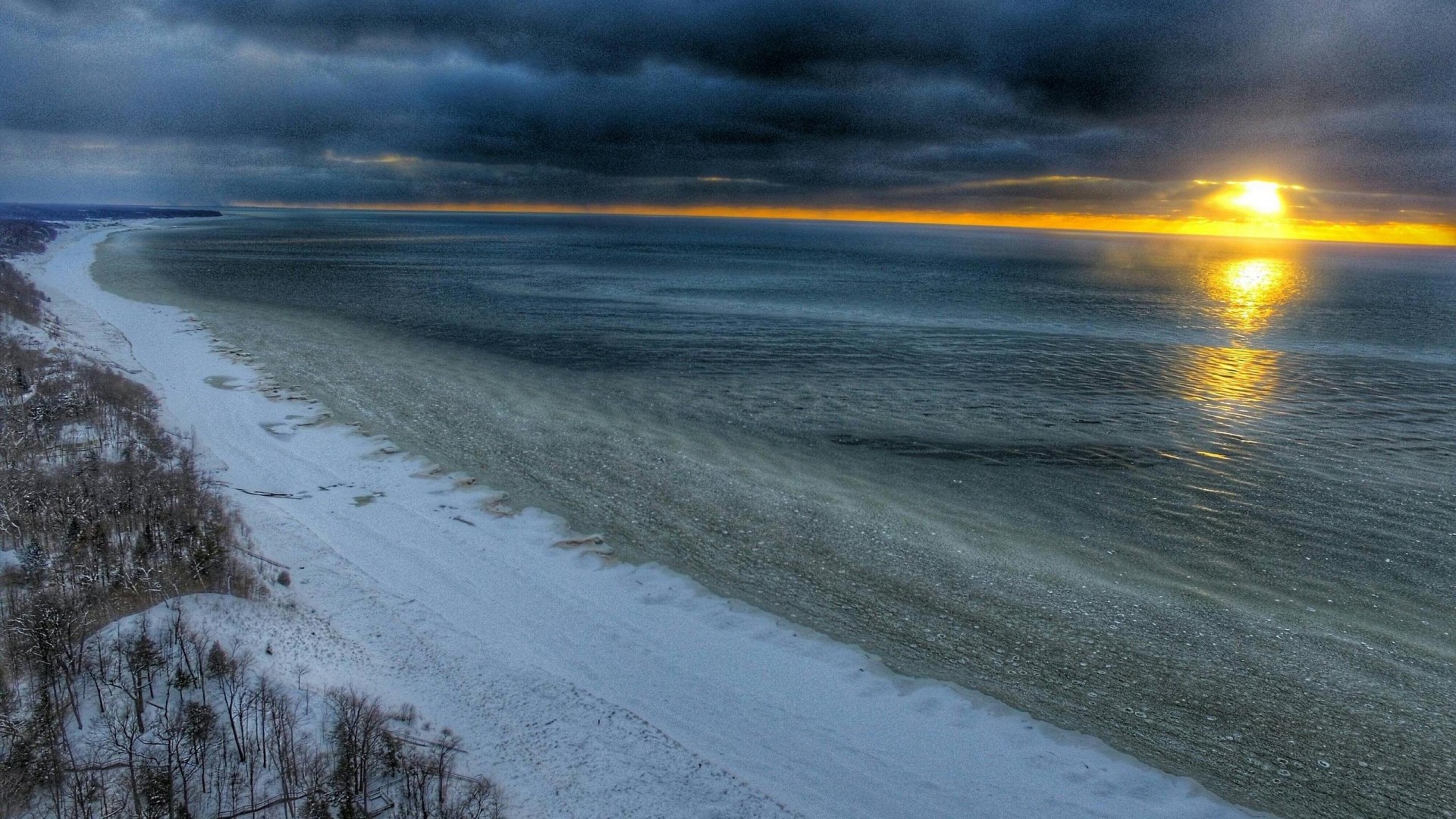 Sunset over frozen Lake Michigan shoreline HD Wallpaper