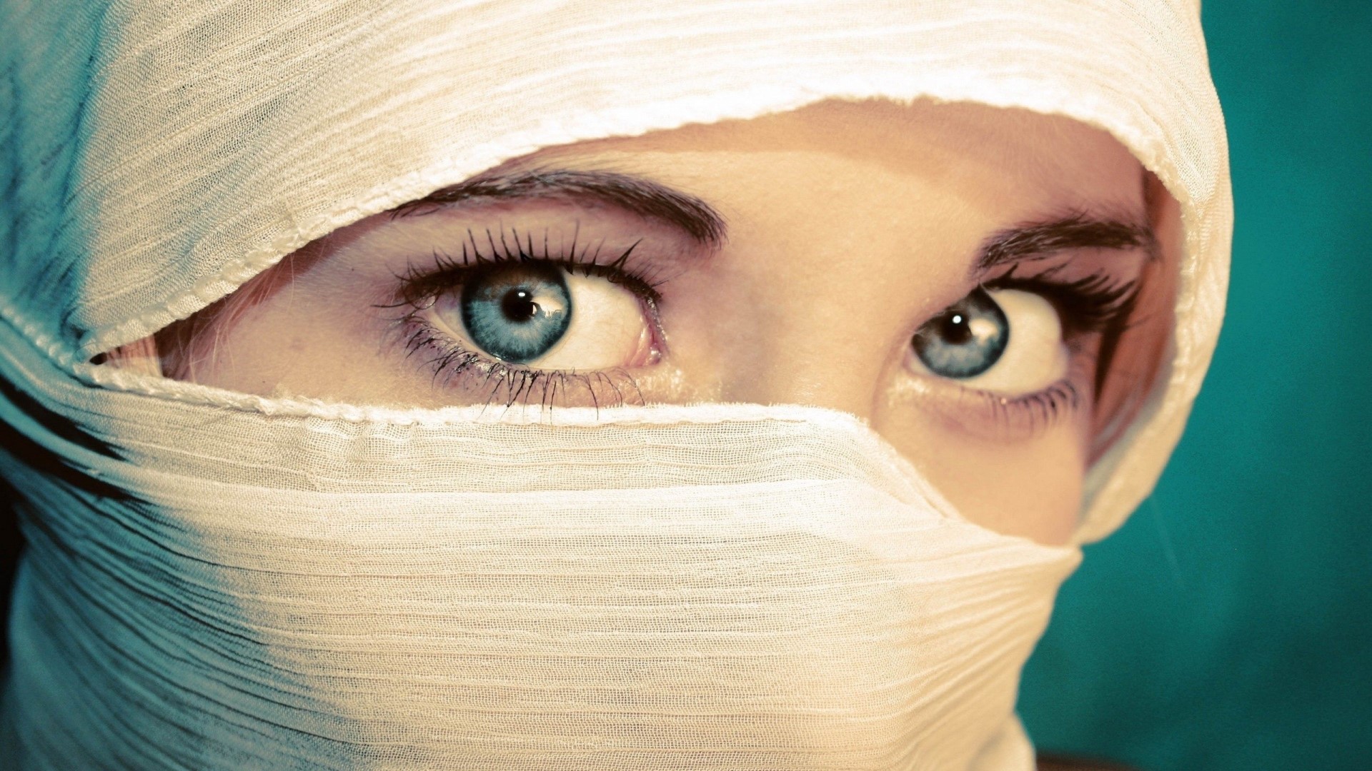 Close-up of a blue-eyed girl with a white headscarf HD Wallpaper