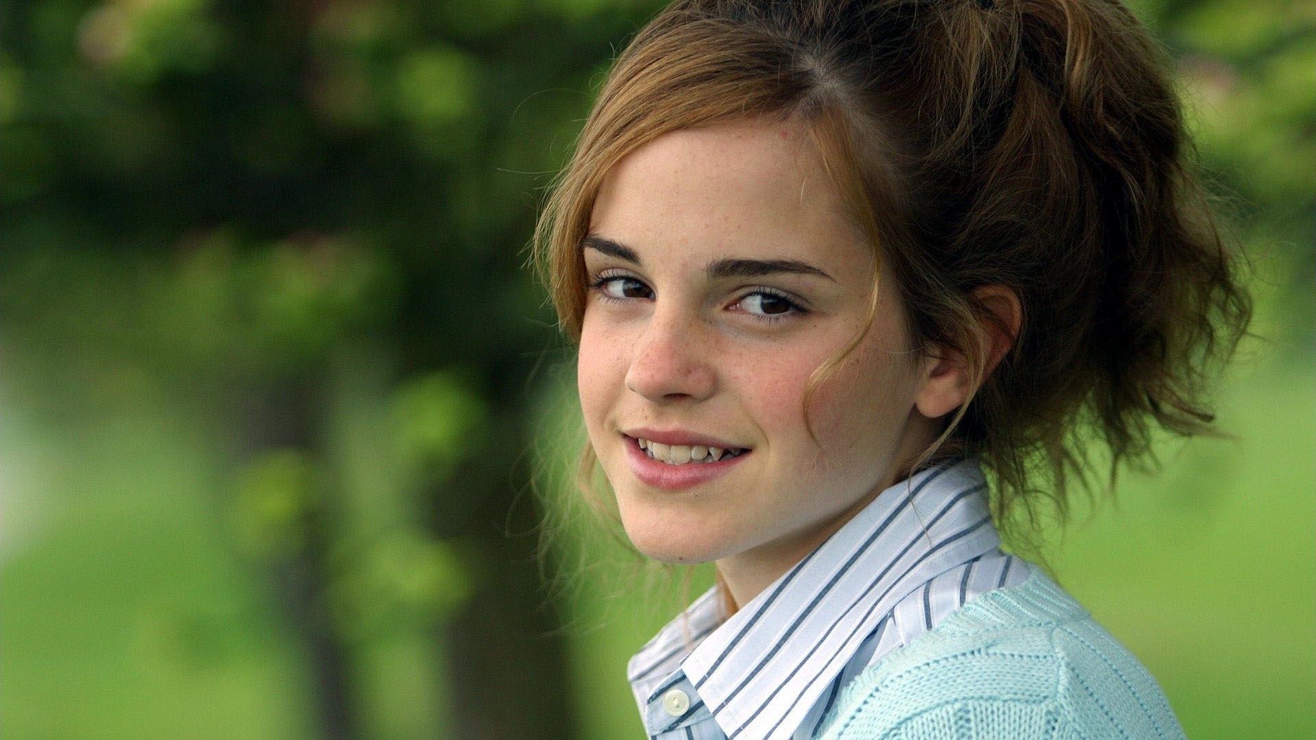 Emma Watson smiling outdoors HD Wallpaper