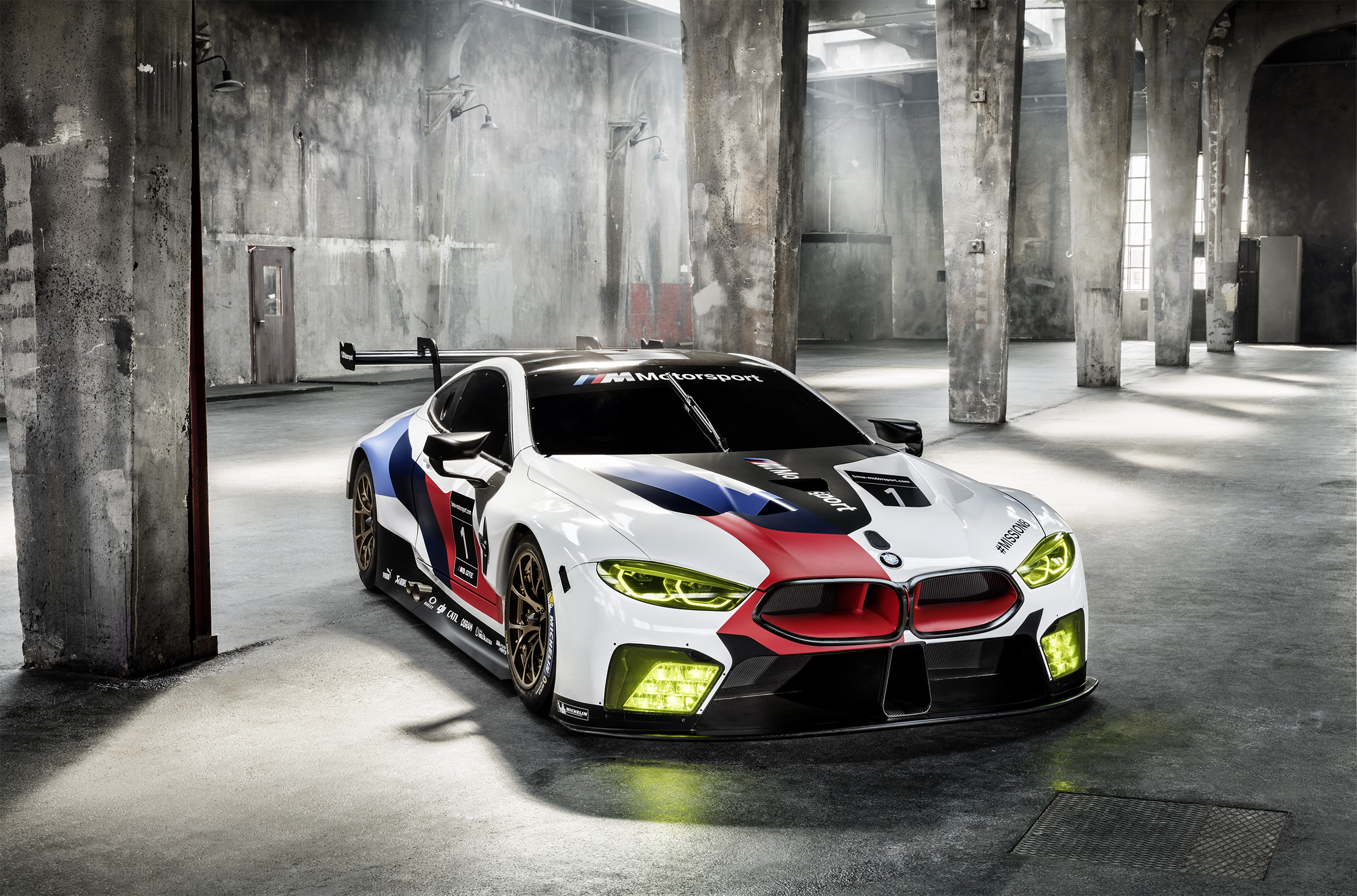 BMW M8 GTE race car in industrial building HD Wallpaper
