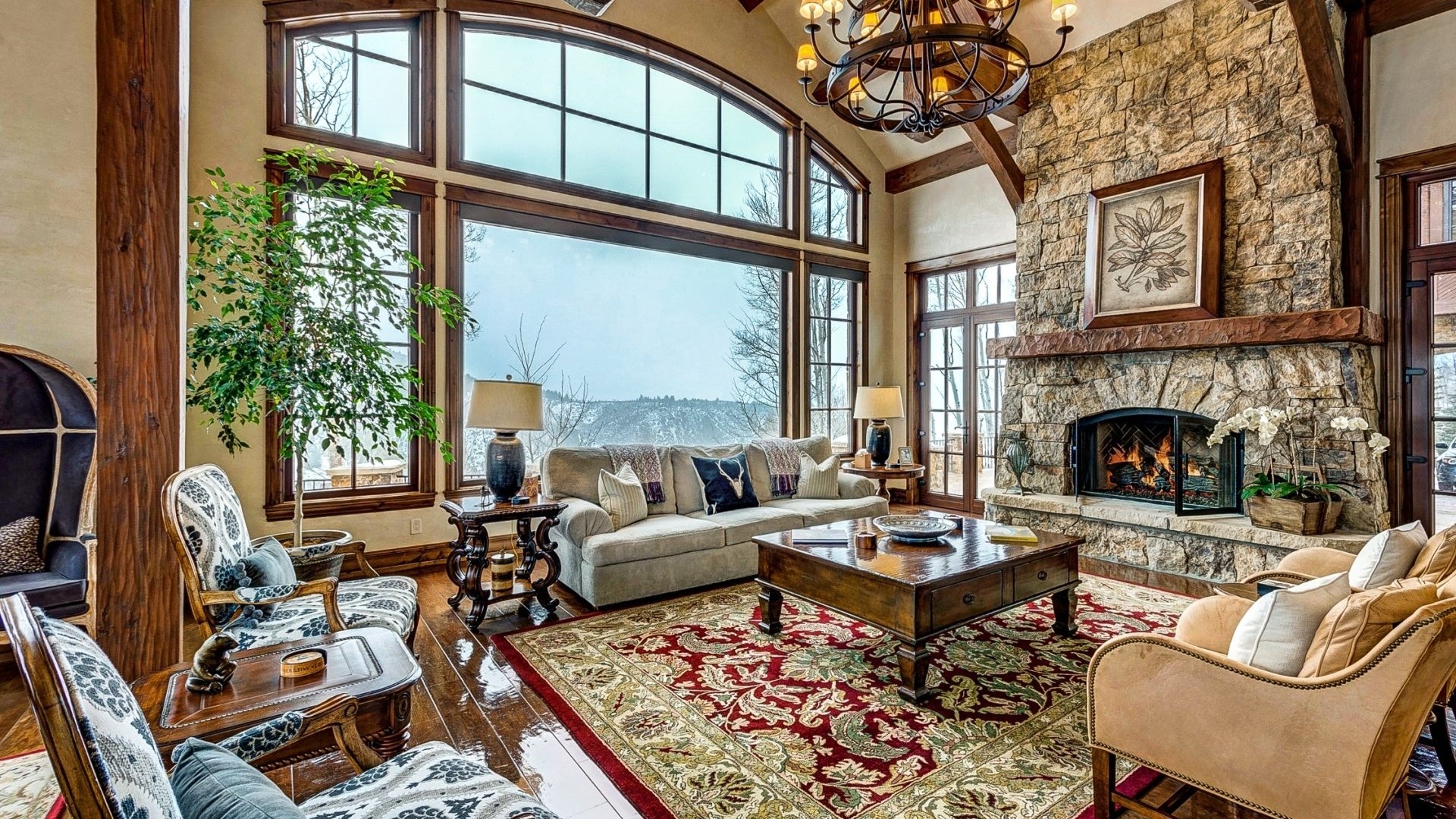 Classic Living Room with Stone Fireplace and Mountain View HD Wallpaper