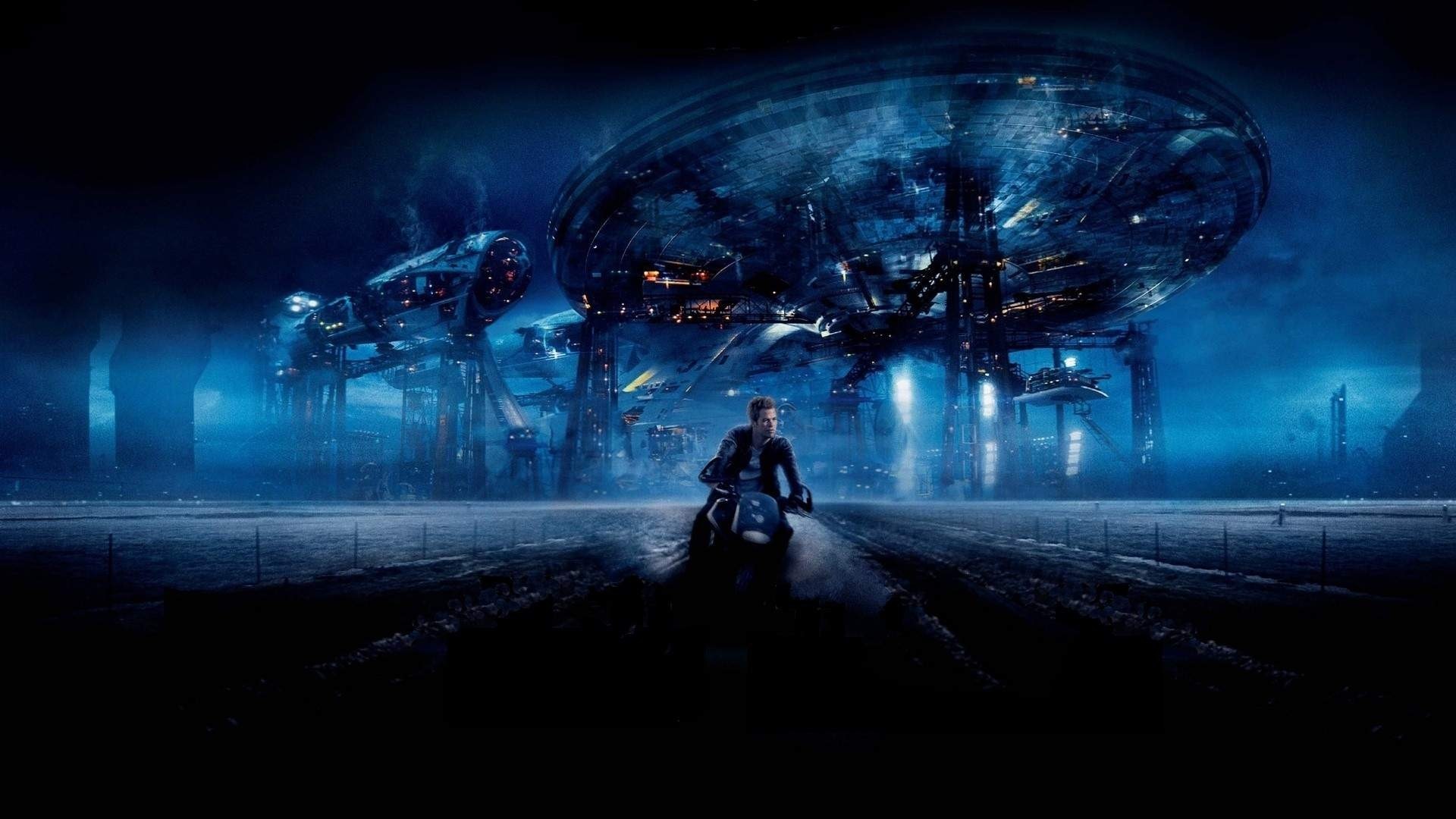 Man on motorcycle in front of alien city HD Wallpaper