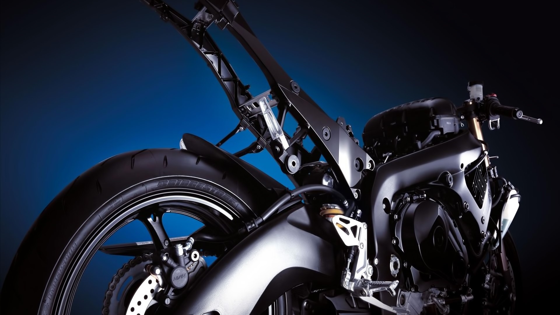 Rear view of a black motorcycle HD Wallpaper