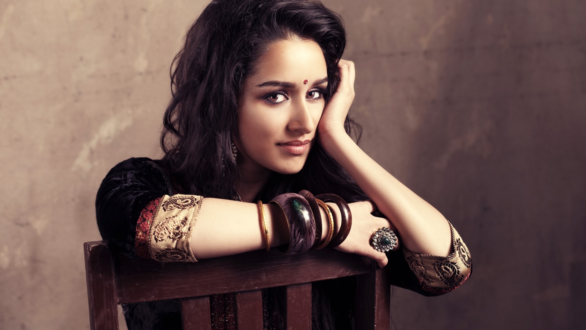 Shraddha Kapoor posing on a chair HD Wallpaper