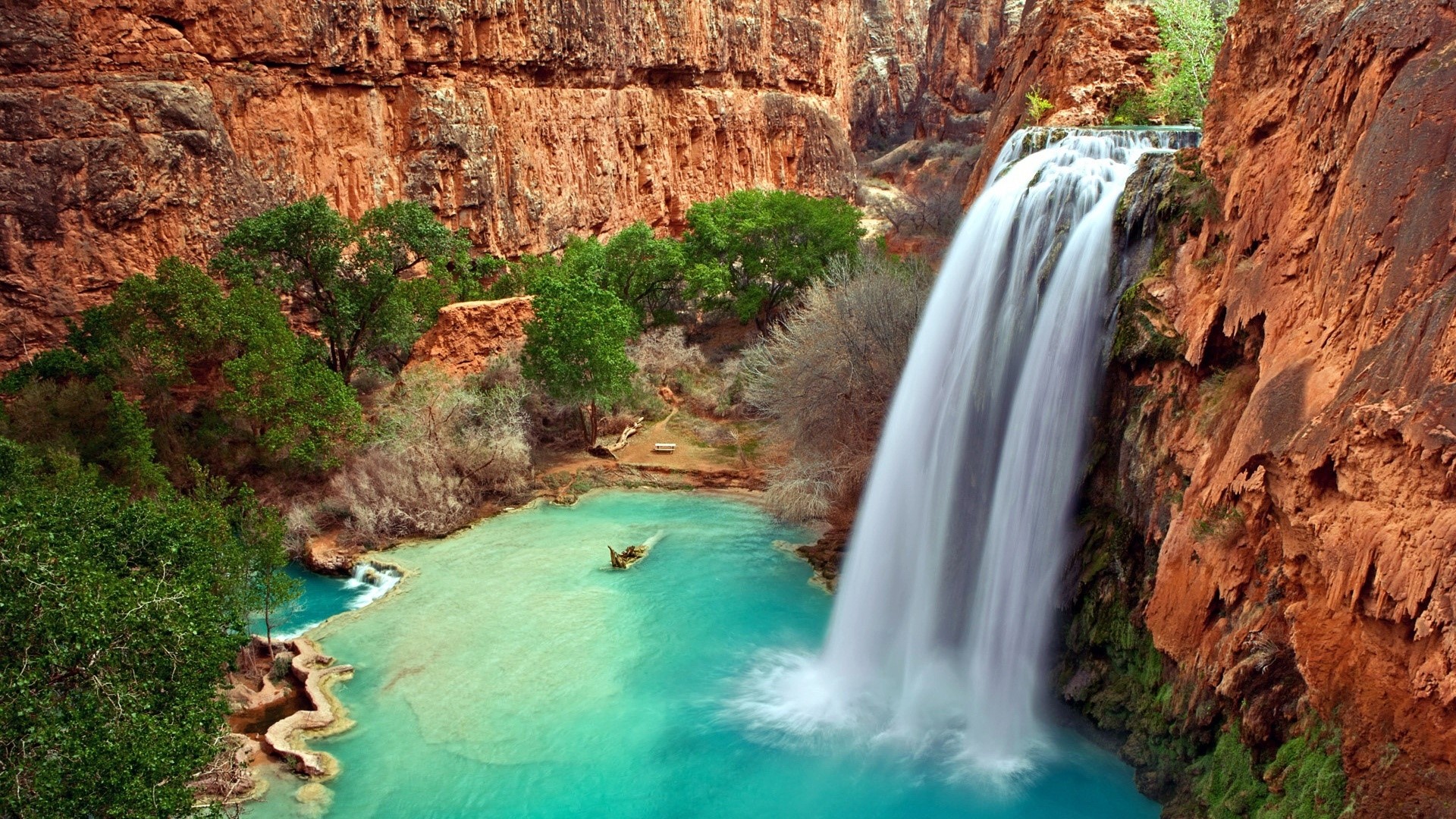 Waterfall in a canyon with turquoise water HD Wallpaper
