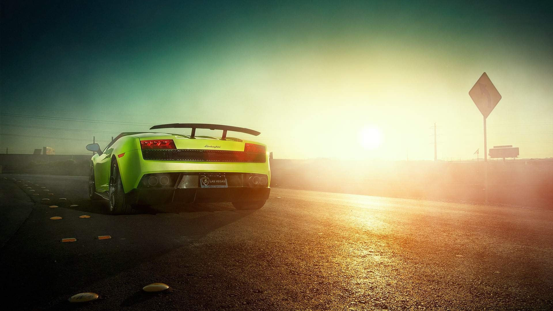 Green Lamborghini on a road at sunset HD Wallpaper