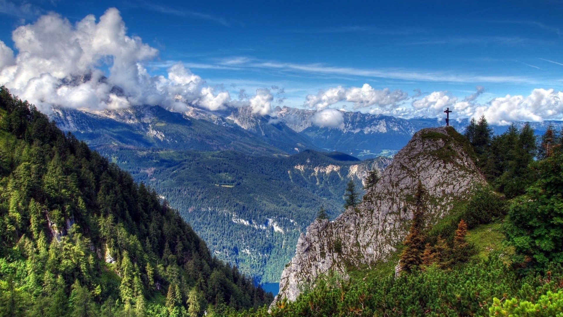 Mountain landscape with a cross on a peak HD Wallpaper