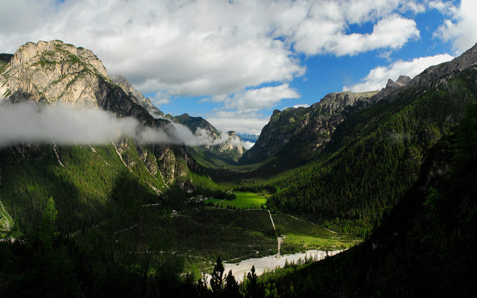 Mountain valley with green forests and clouds HD Wallpaper