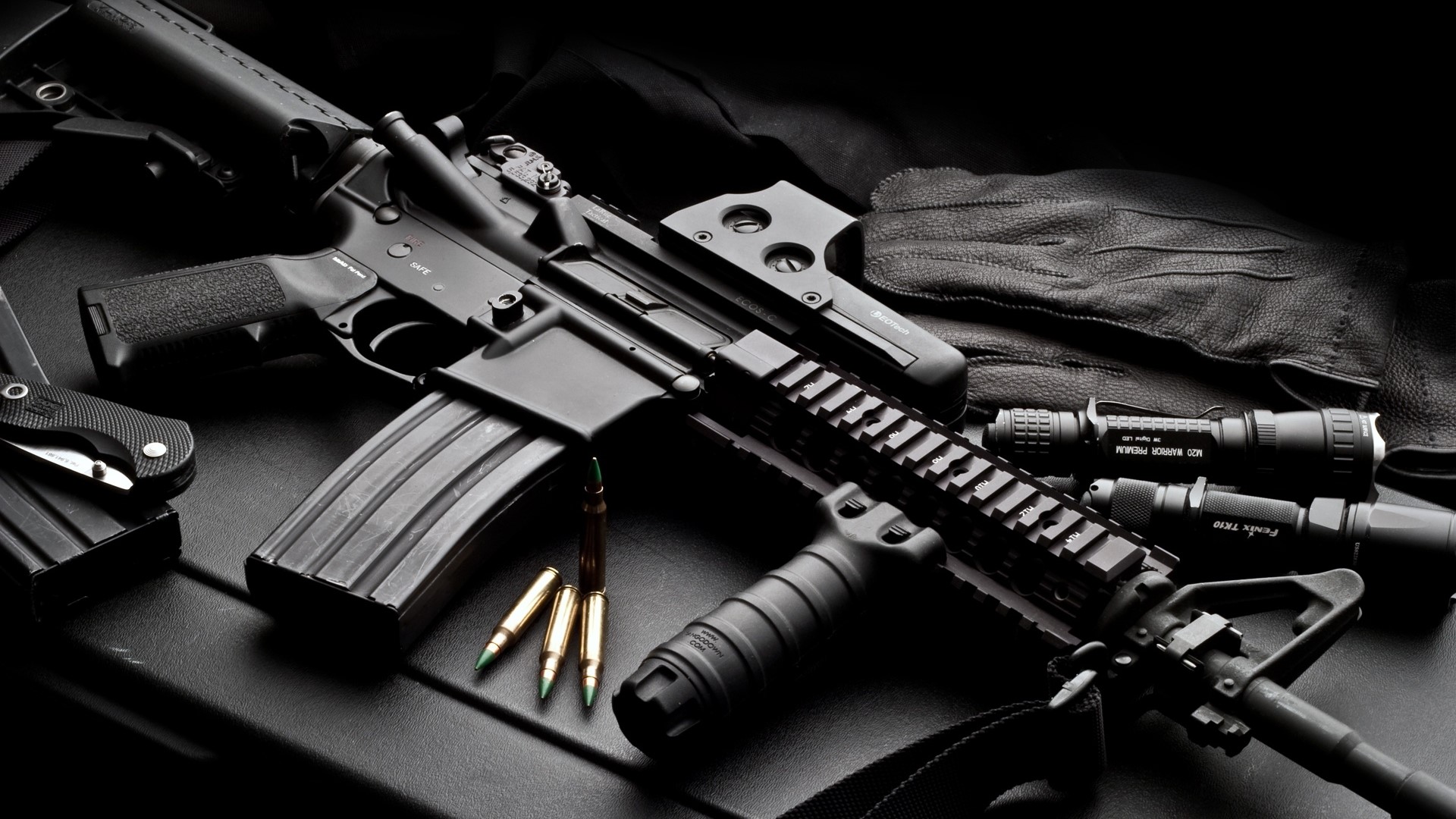 AR-15 rifle with accessories and ammunition HD Wallpaper