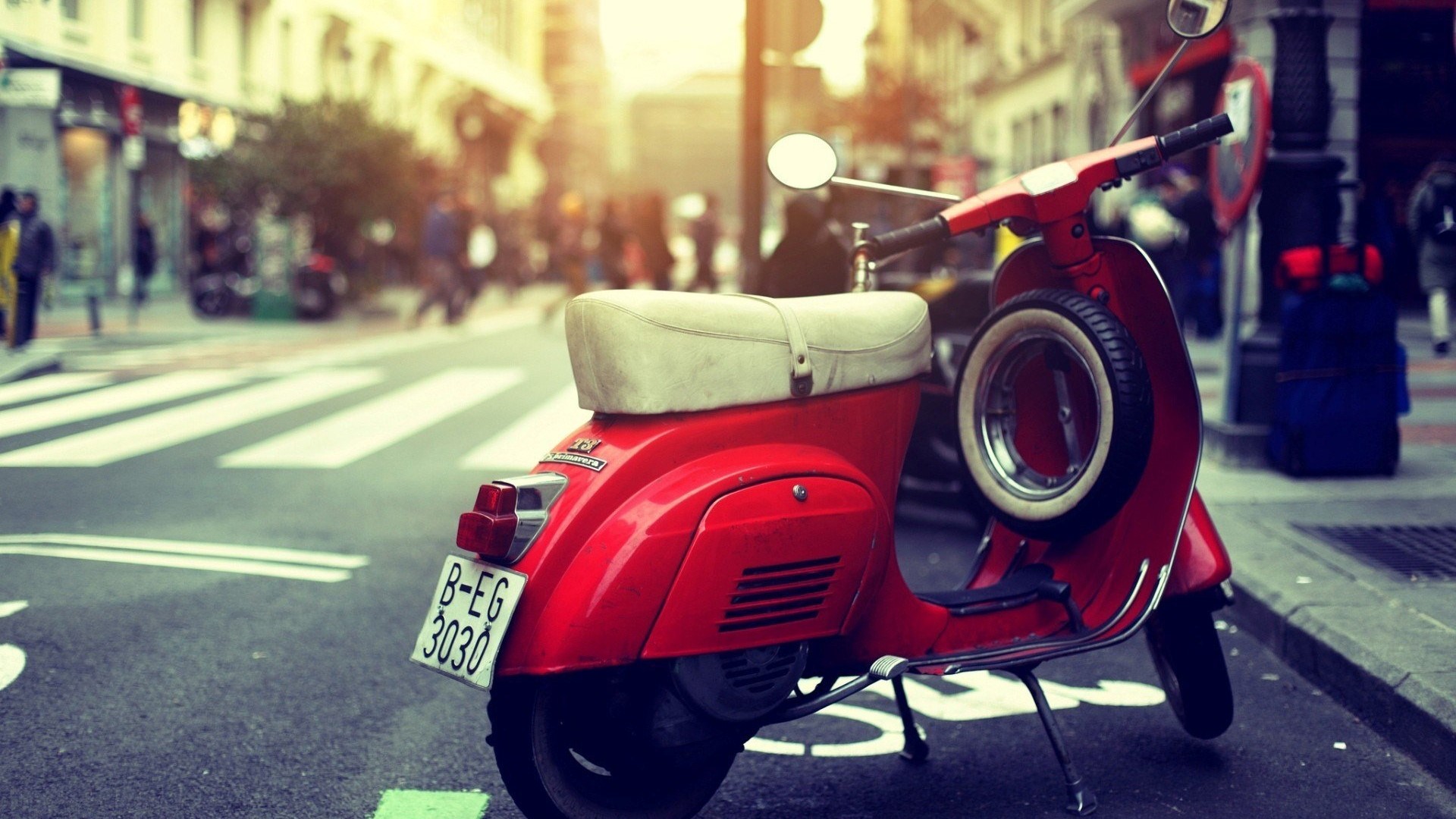 Red Vespa Scooter on a City Street HD Wallpaper