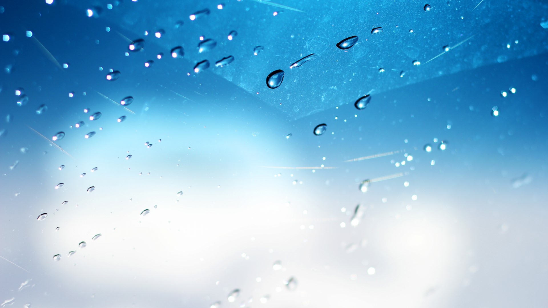 Water droplets on a blue surface HD Wallpaper