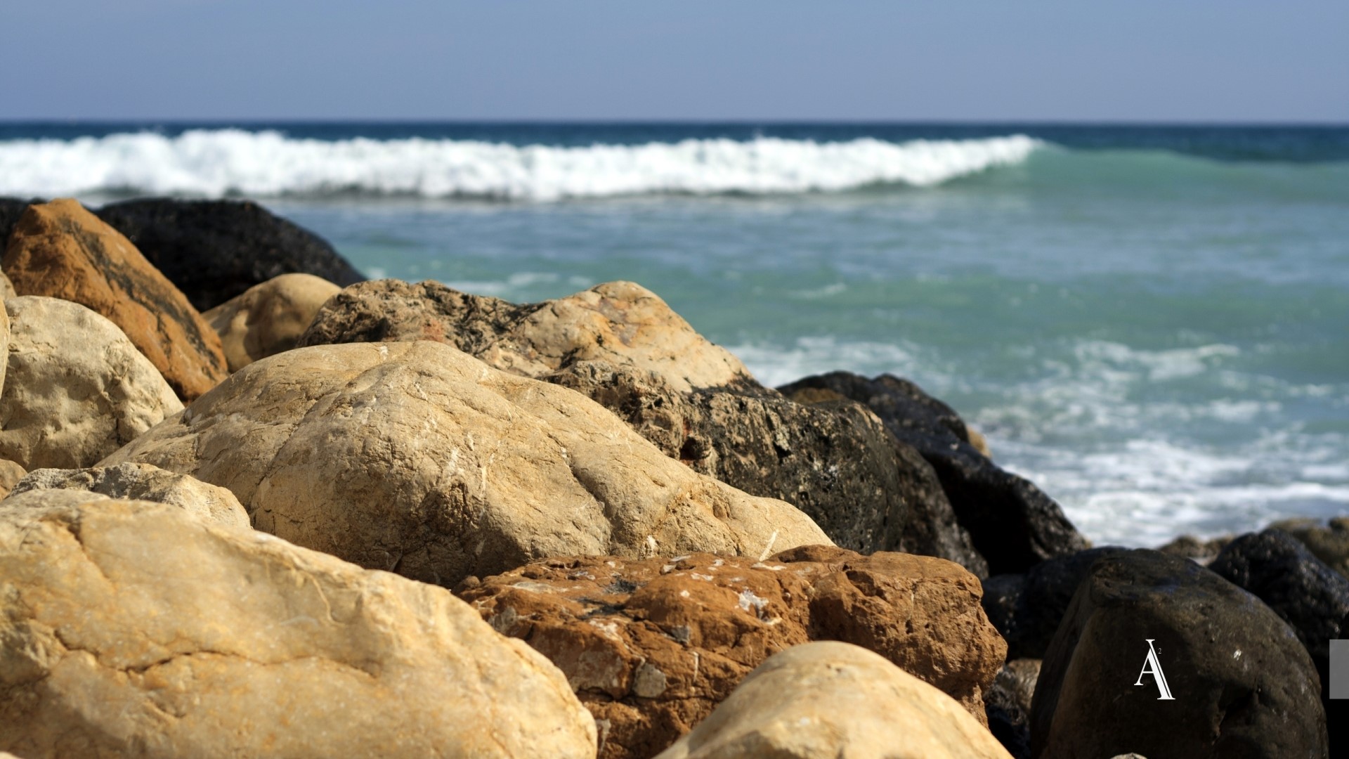 Rocks on a Beach with Ocean Waves HD Wallpaper
