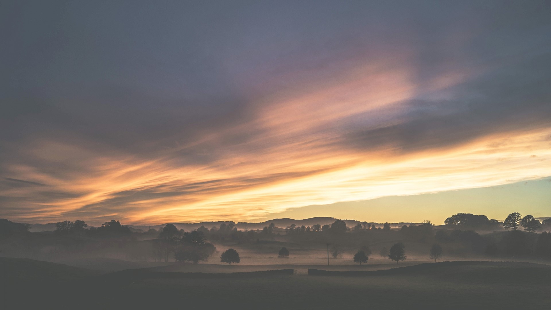 Misty landscape at sunrise with colorful clouds HD Wallpaper