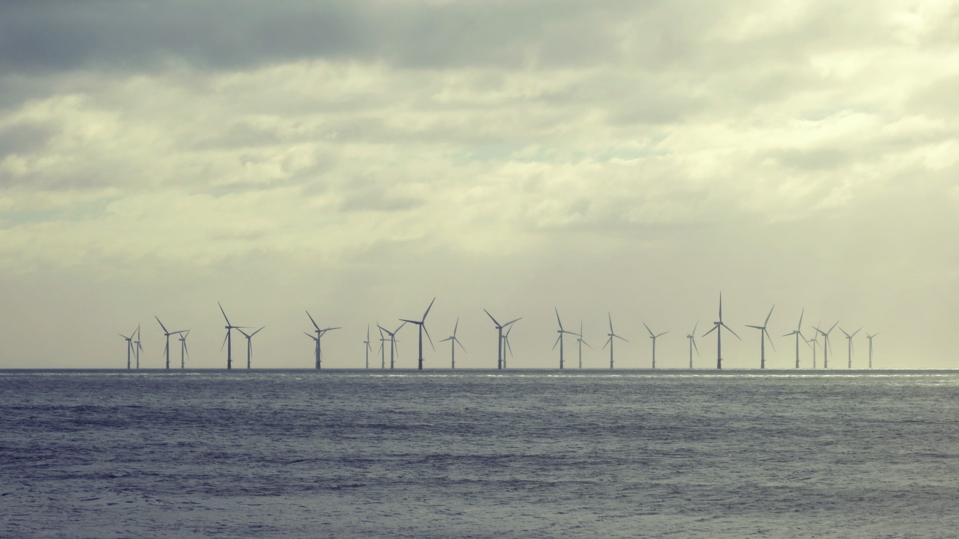 Offshore wind farm on a cloudy day HD Wallpaper