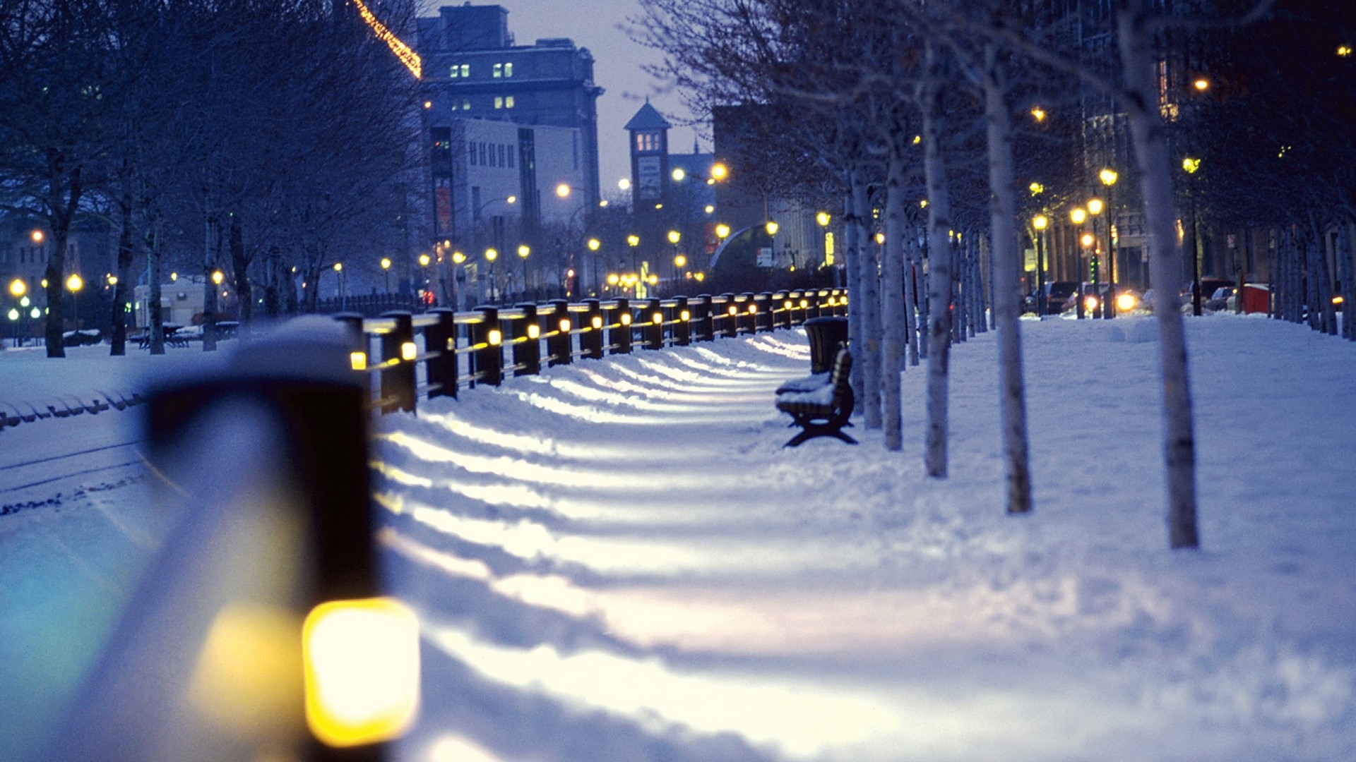 Winter city street with lights and snow HD Wallpaper