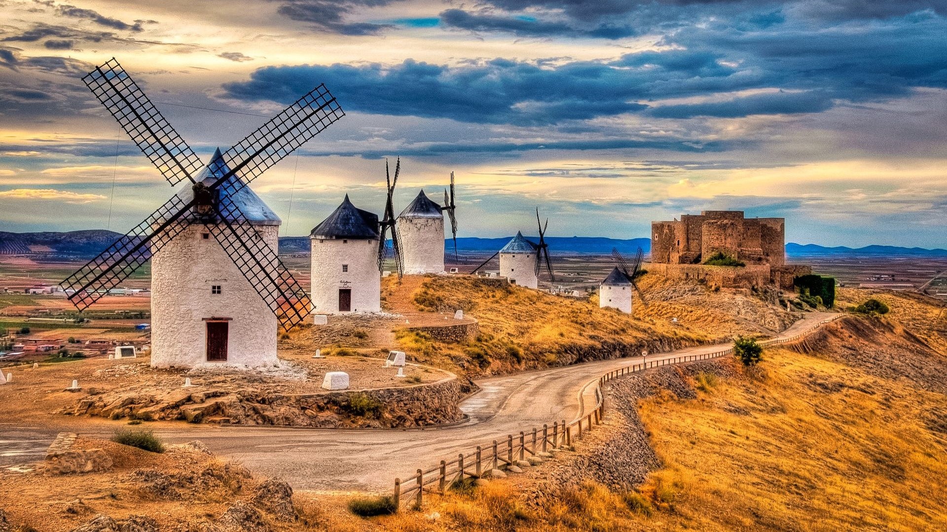 Windmills and castle on a hill HD Wallpaper