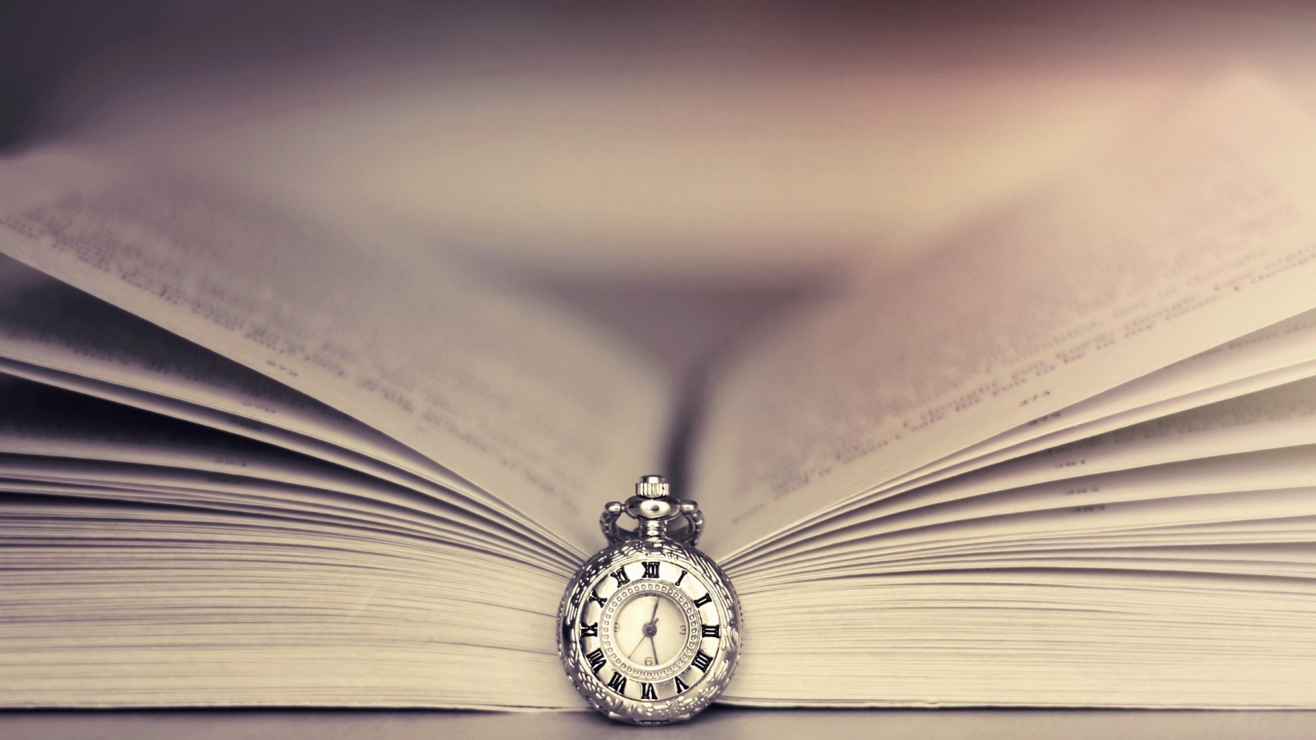 Vintage pocket watch on an open book HD Wallpaper