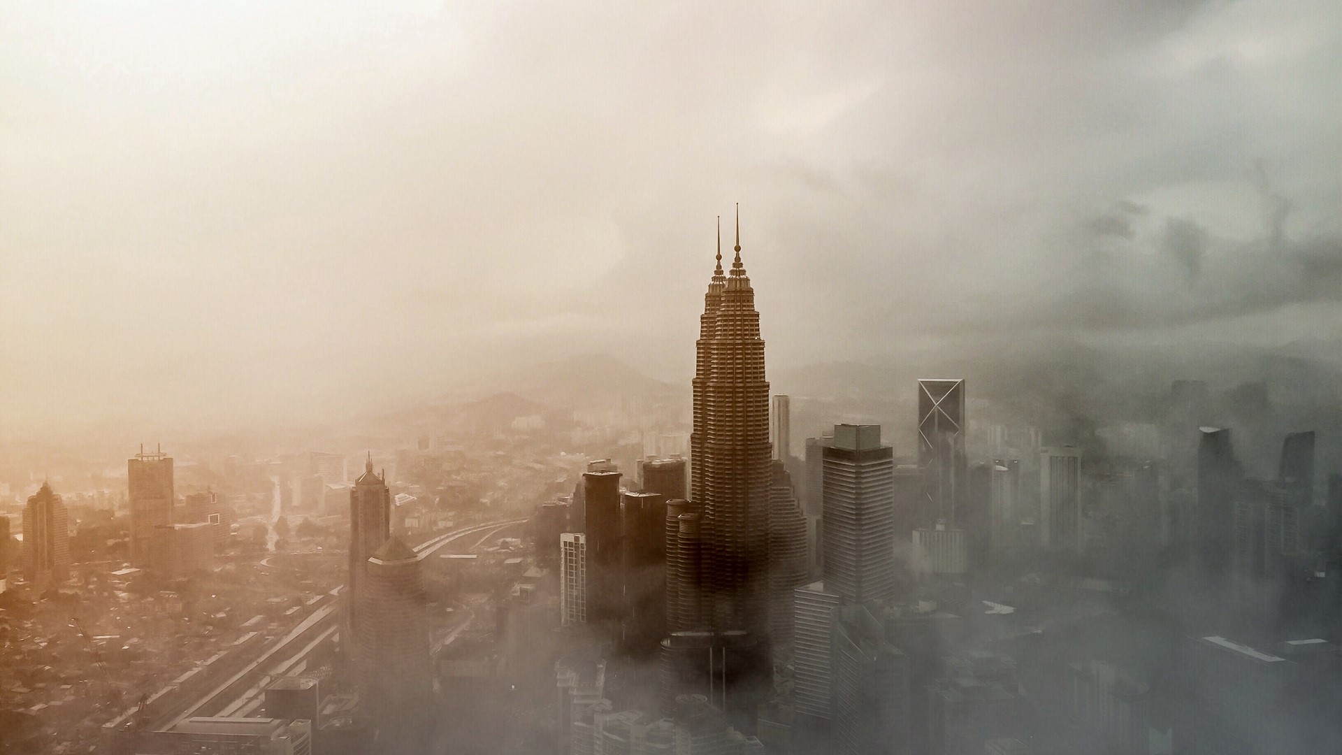 Petronas Towers in Kuala Lumpur shrouded in fog HD Wallpaper