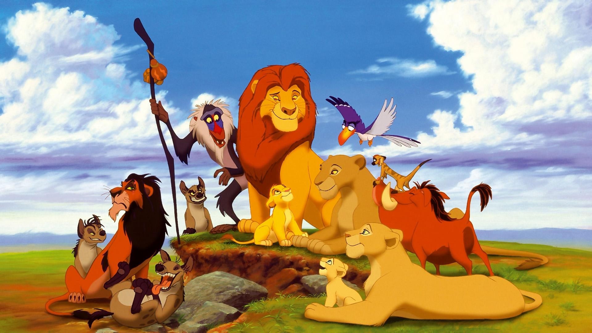 The Lion King characters on a grassy hill HD Wallpaper