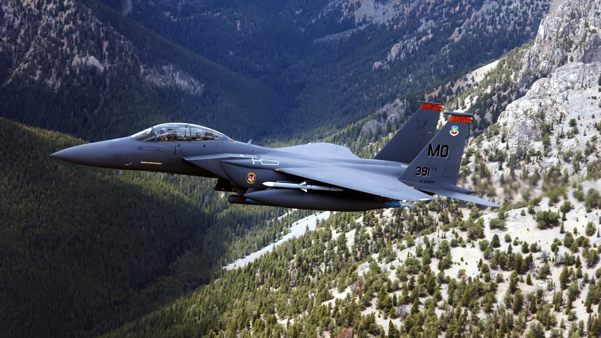 US Air Force F-15 Eagle fighter jet flying over mountains HD Wallpaper