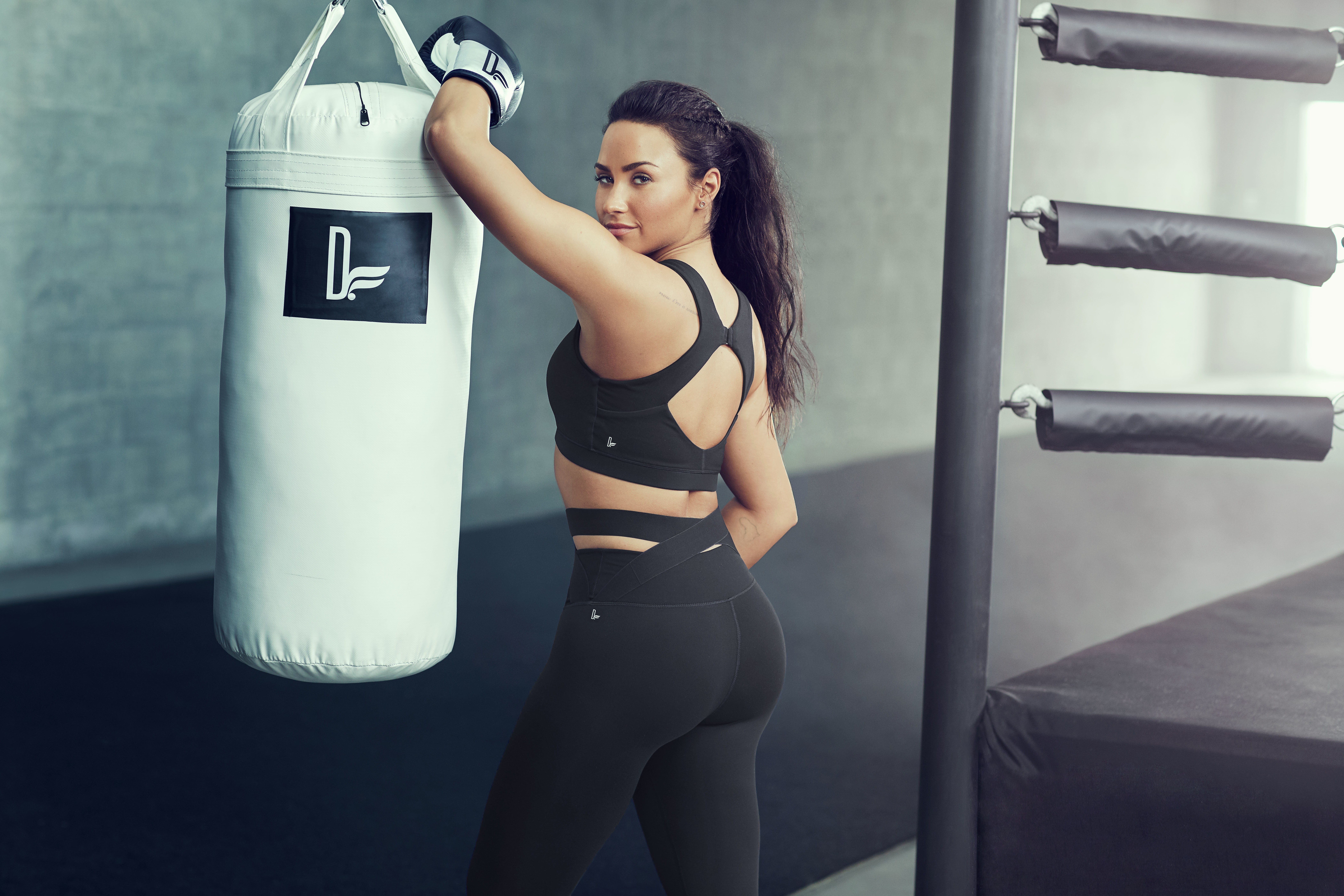 Demi Lovato in Fabletics sportswear with punching bag HD Wallpaper