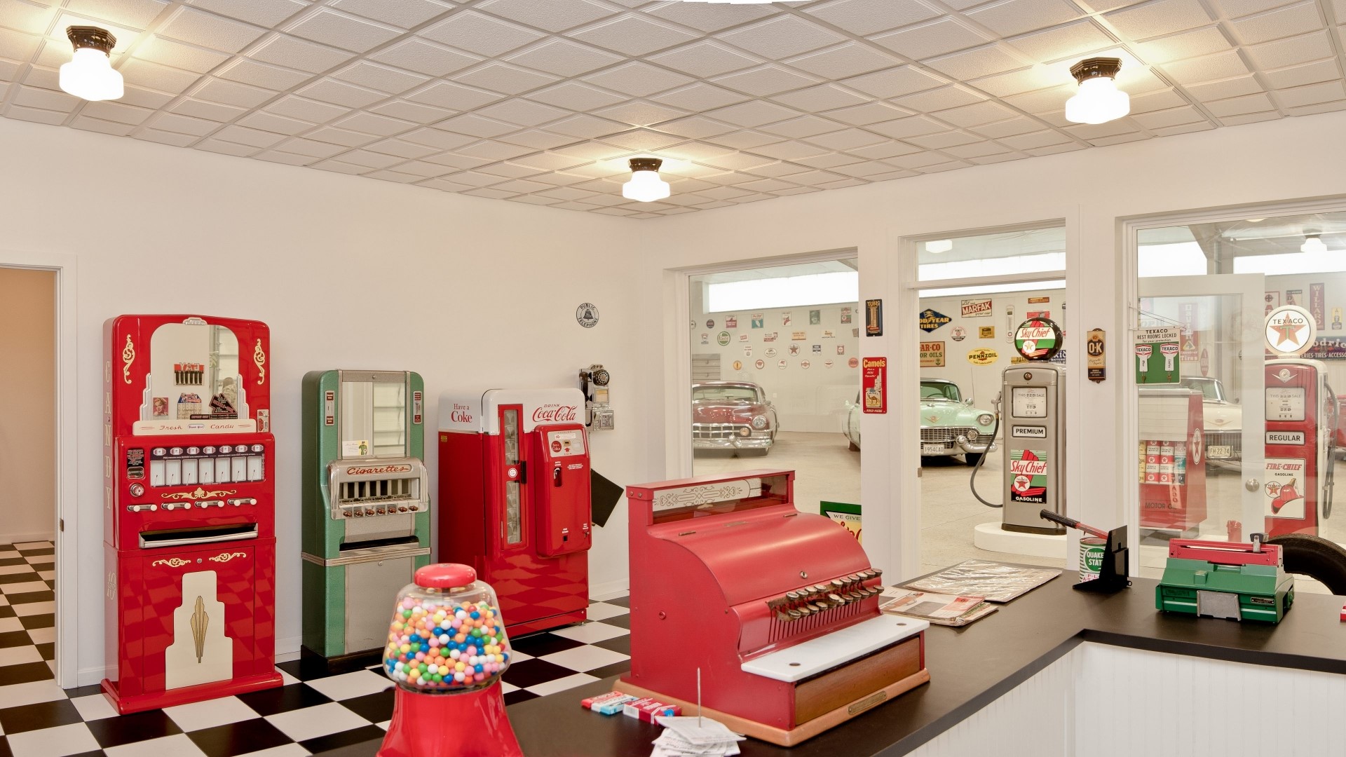 Vintage Garage Interior with Classic Cars and Vending Machines HD Wallpaper