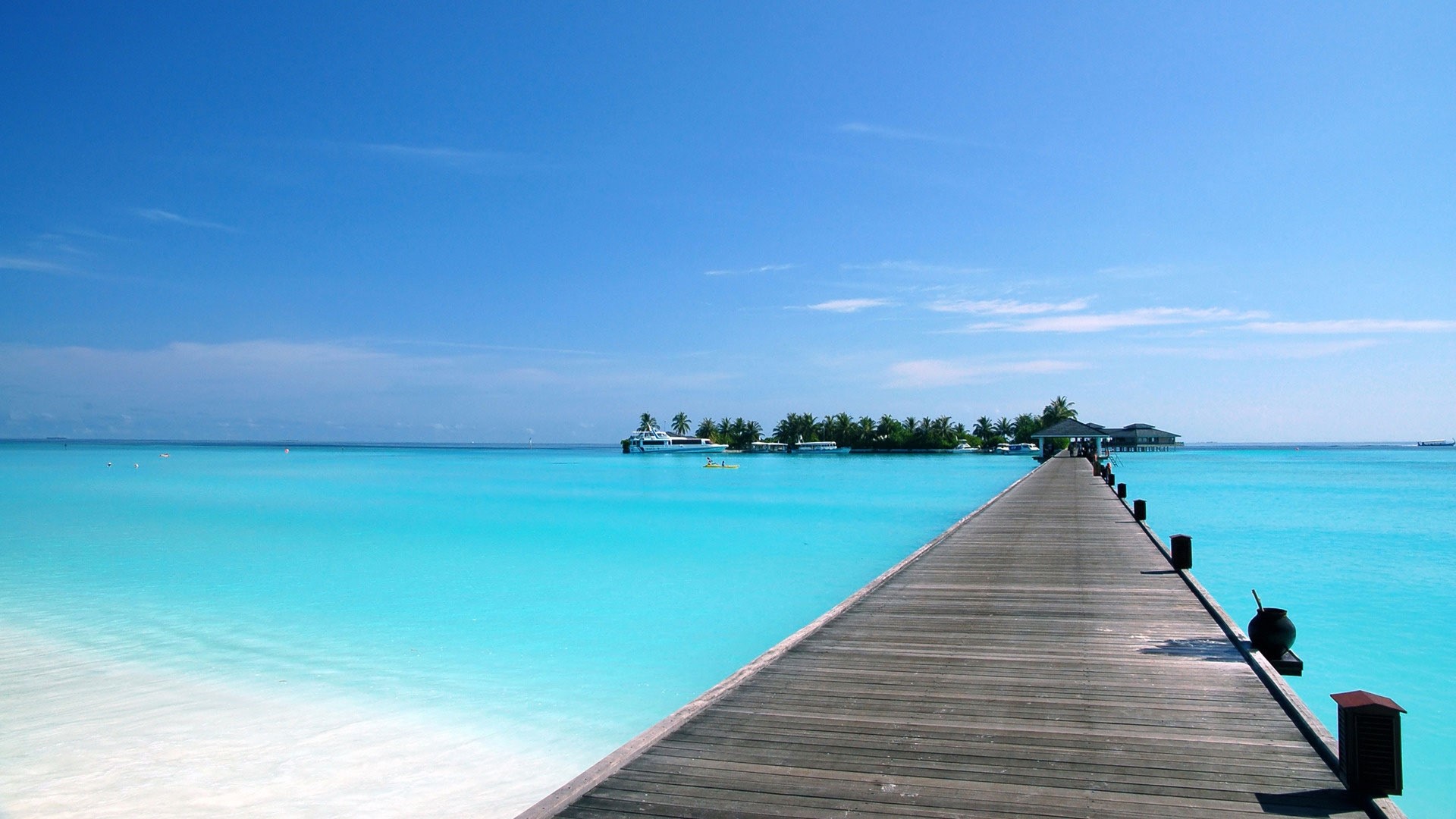 Wooden pier on a tropical island with turquoise water HD Wallpaper