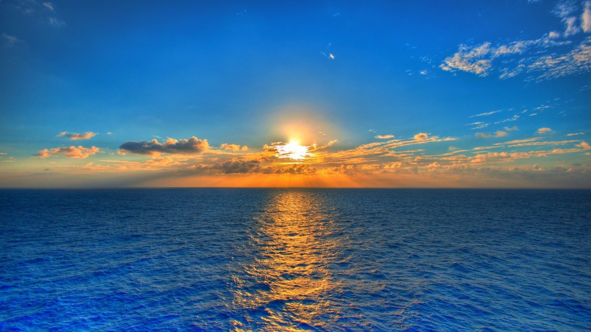 Sunset over the ocean with clouds HD Wallpaper