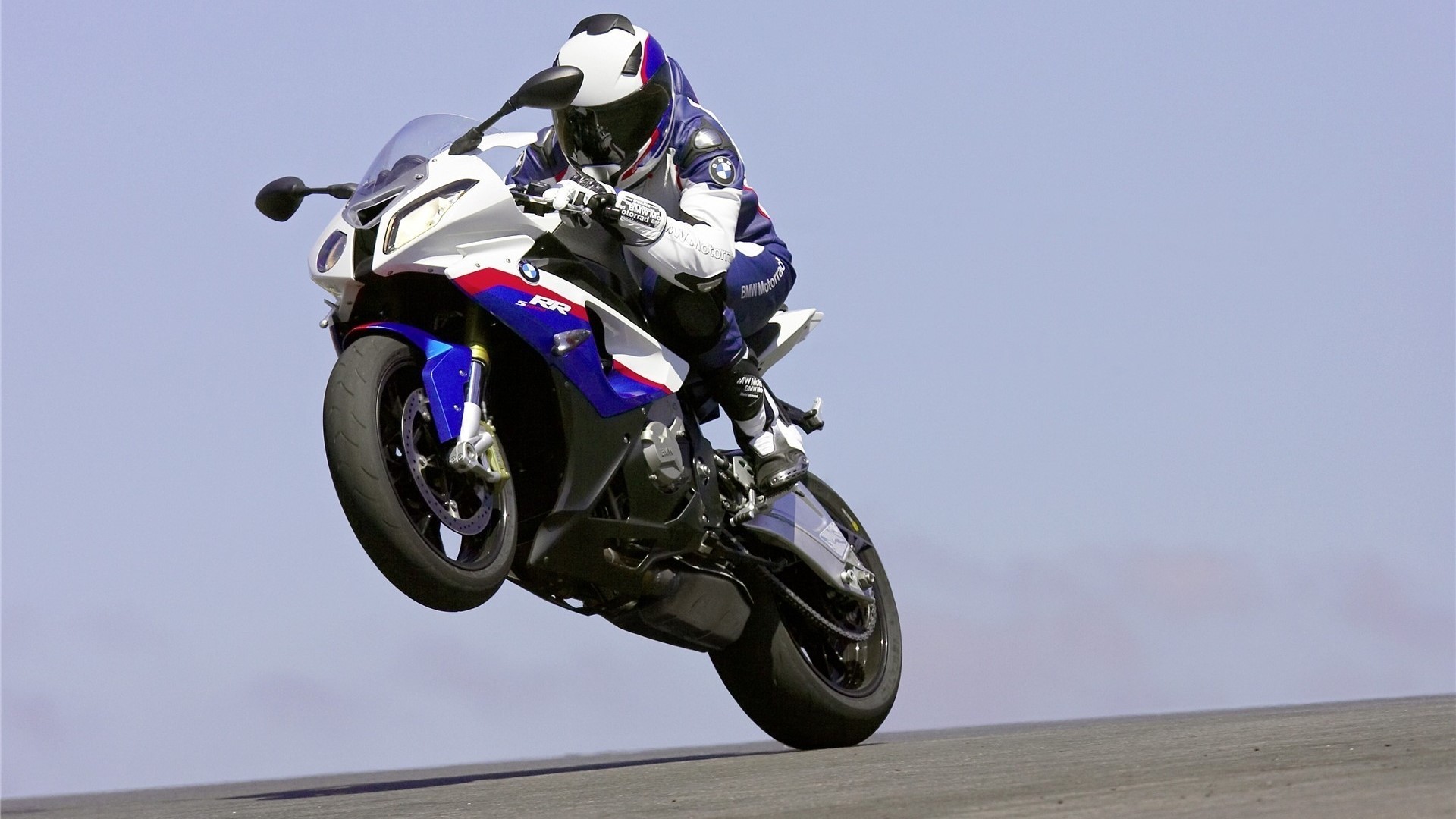 BMW S1000RR motorcycle performing a wheelie HD Wallpaper