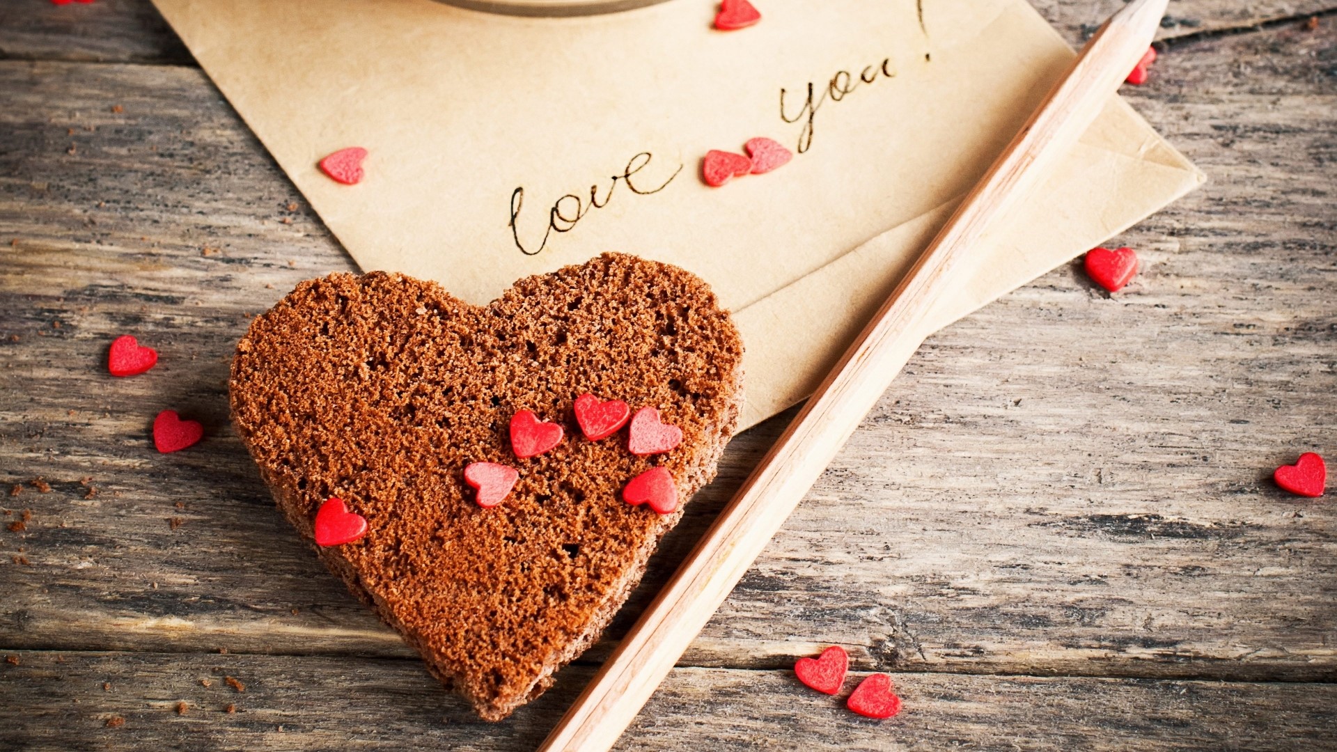 Heart-shaped cookie with love note and pencil HD Wallpaper