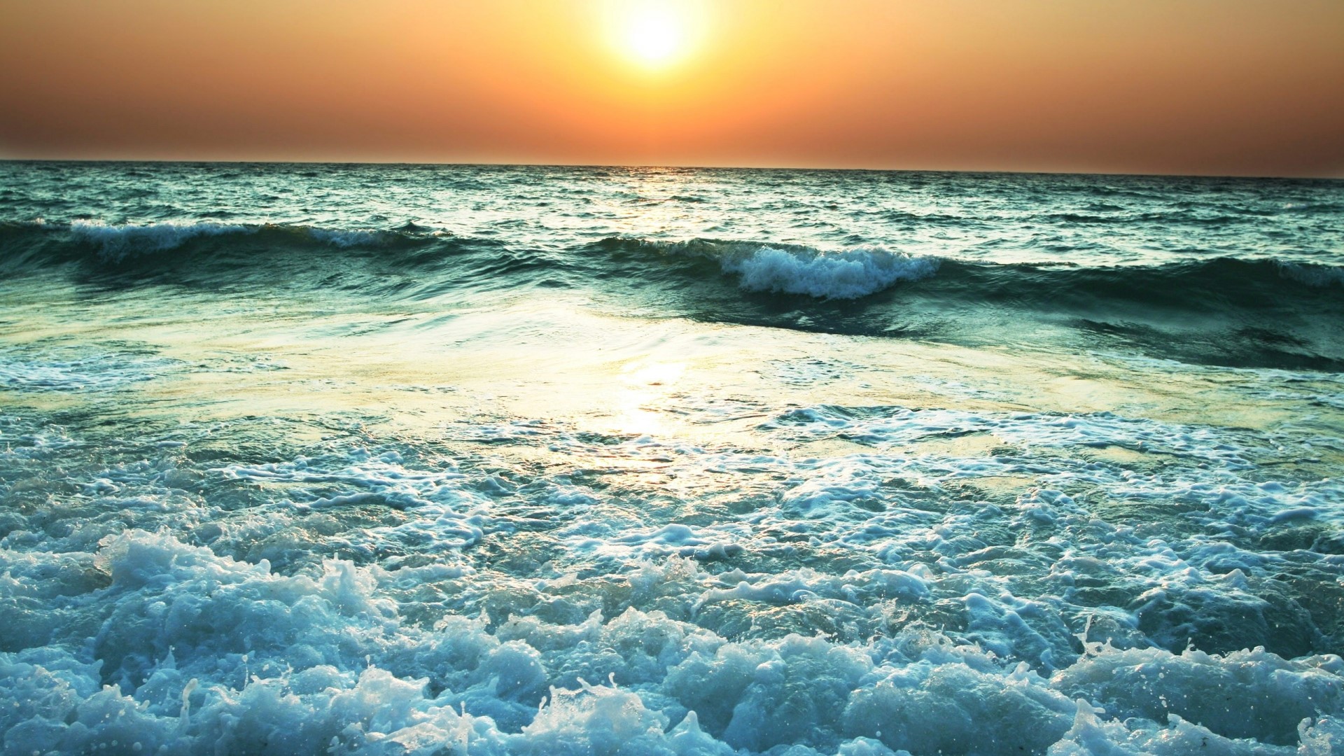 Sunset over the sea with waves HD Wallpaper