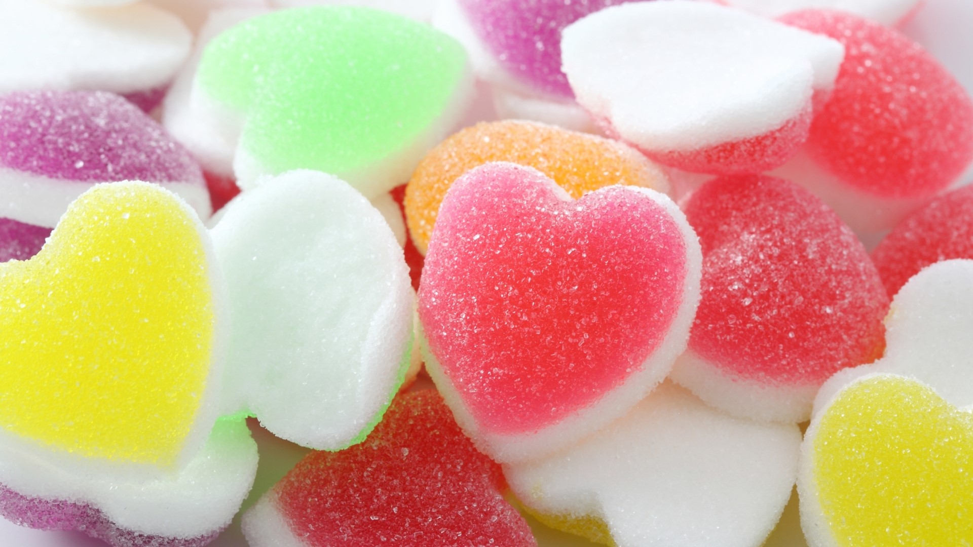 Assortment of colorful heart-shaped candies HD Wallpaper