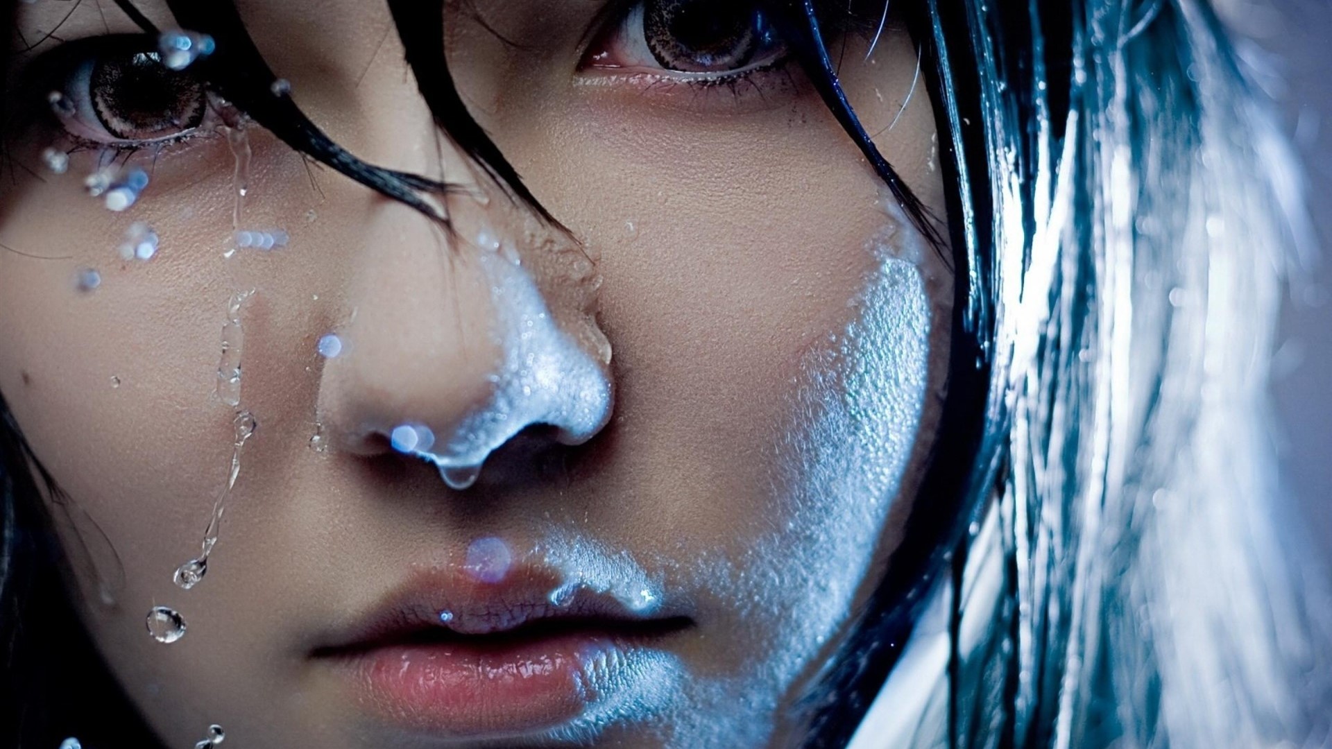 Close-up of a girl's face with water droplets HD Wallpaper