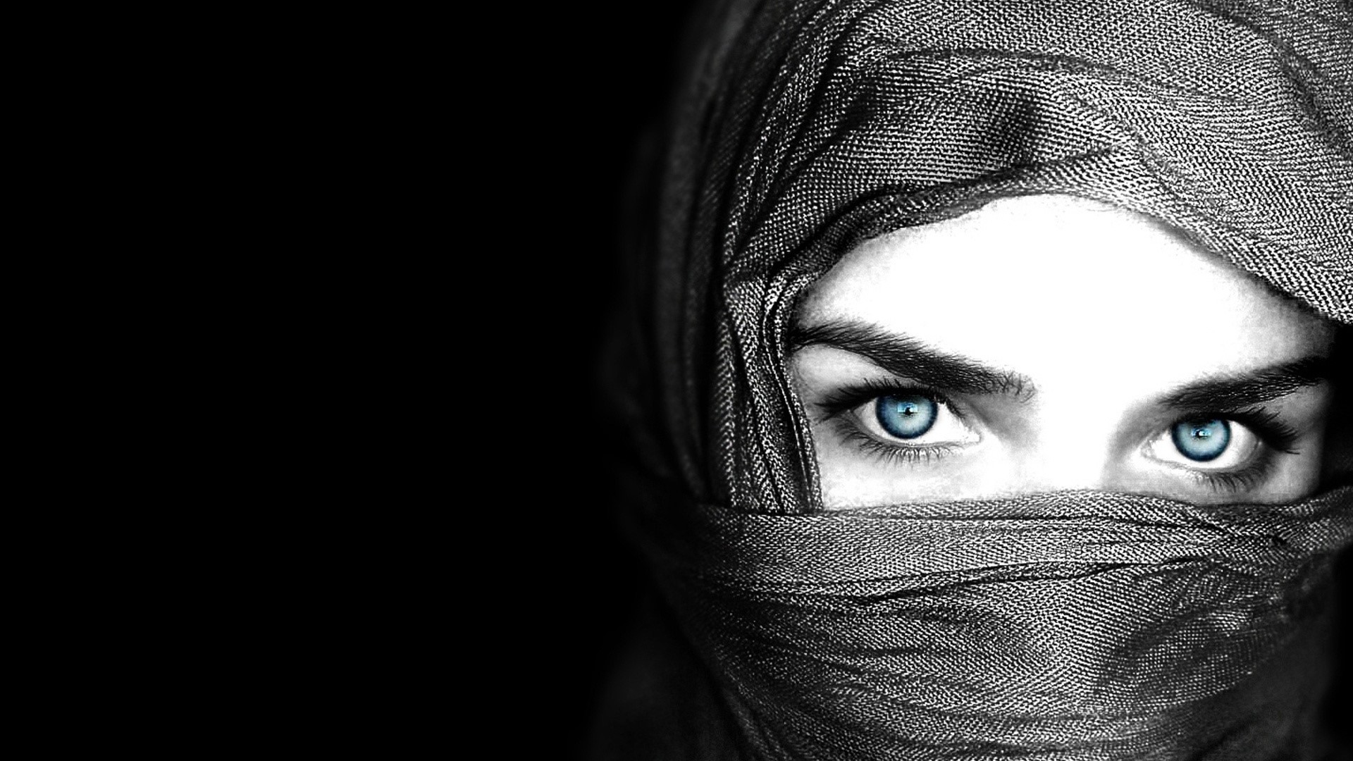 Close-up of a person with blue eyes wearing a headscarf HD Wallpaper