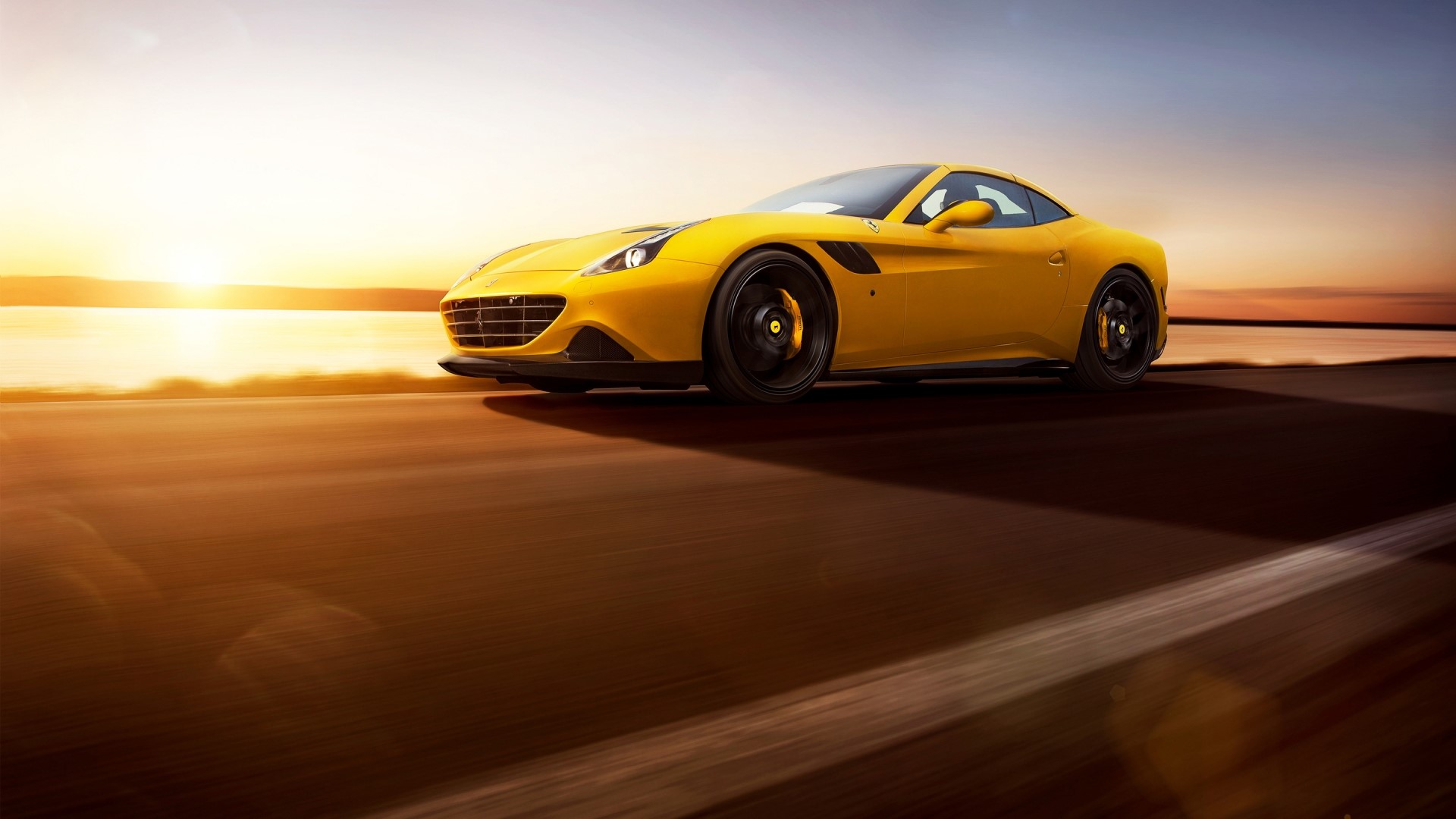 Yellow Ferrari California T driving at sunset HD Wallpaper