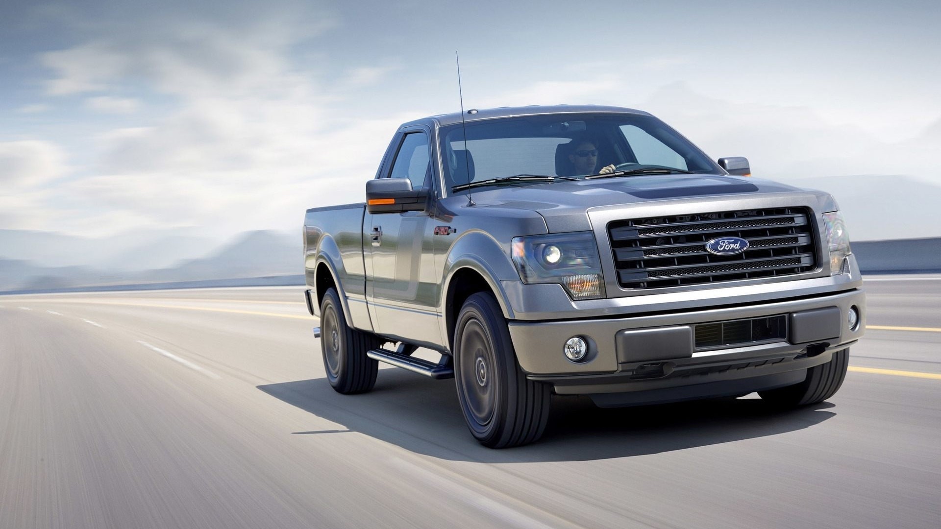 Ford F-150 Tremor pickup truck driving on a highway HD Wallpaper