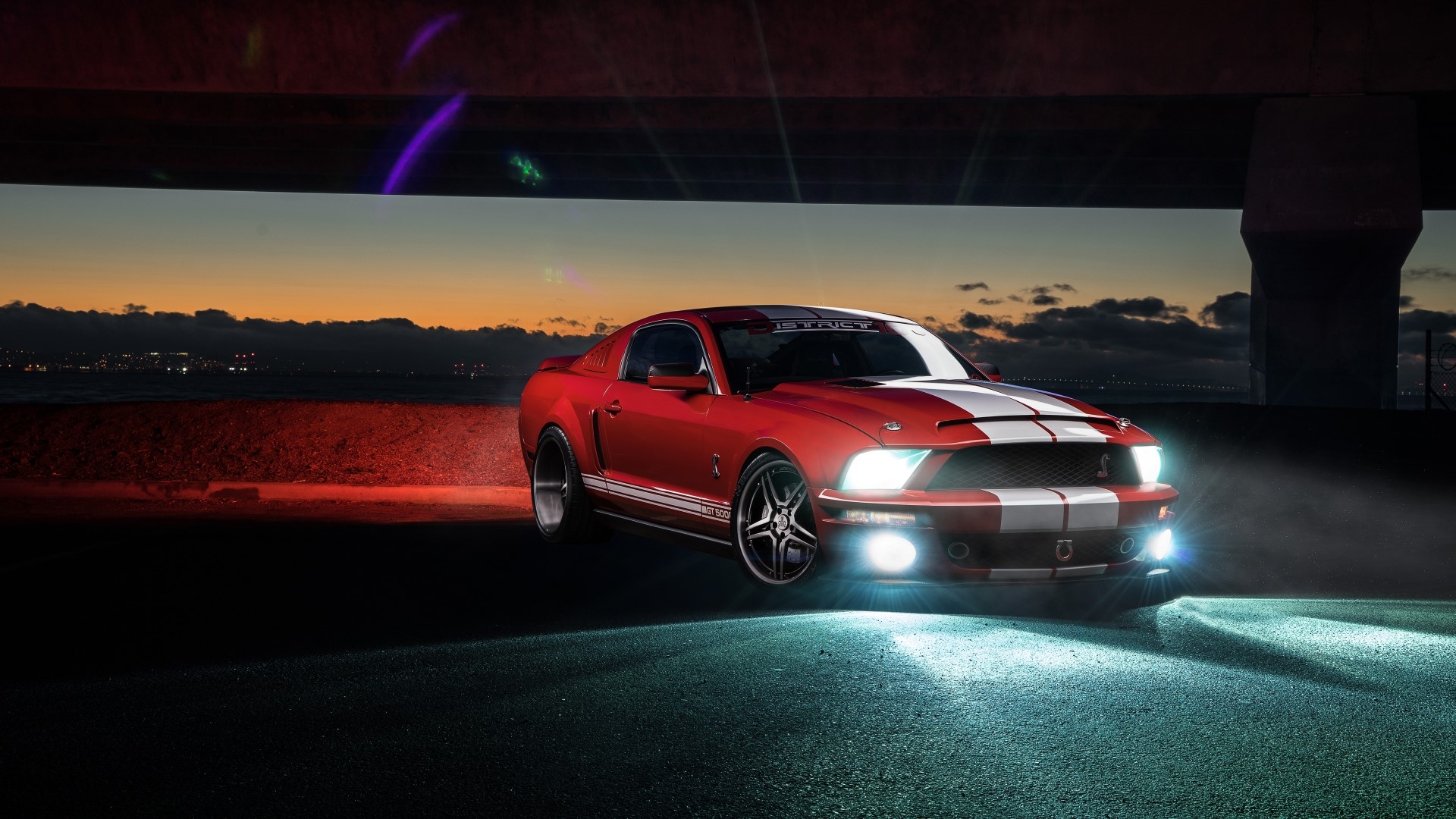 Red Ford Mustang Shelby GT500 under bridge at dusk HD Wallpaper